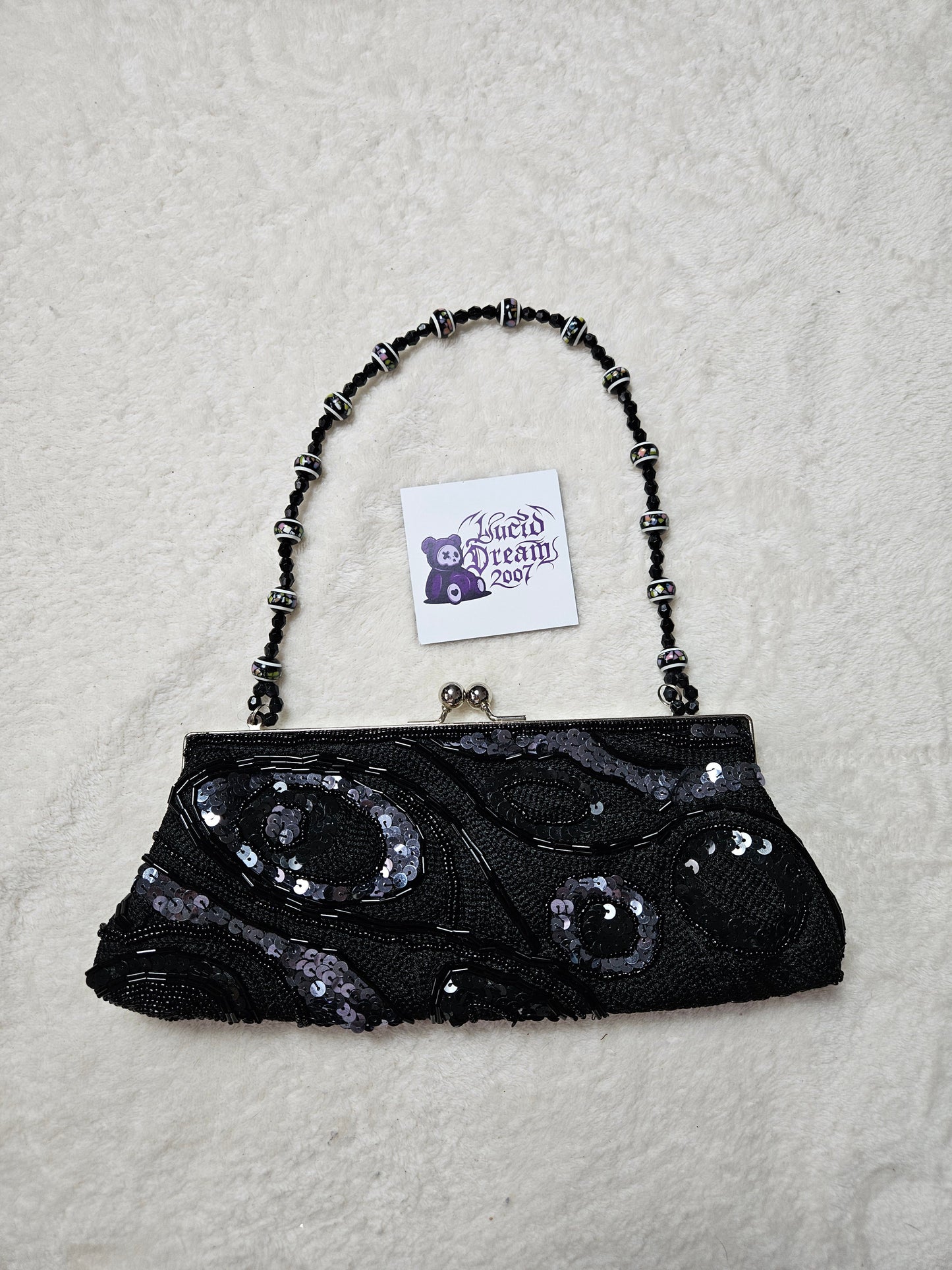 Bandolera negra con perlas y lentejuelas