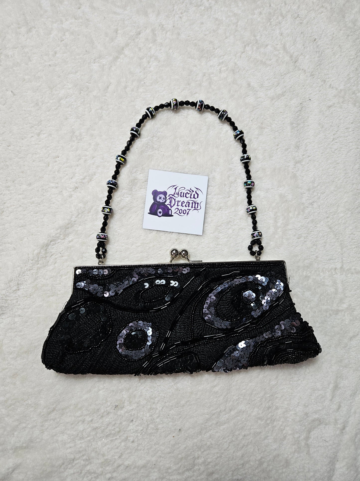Bandolera negra con perlas y lentejuelas