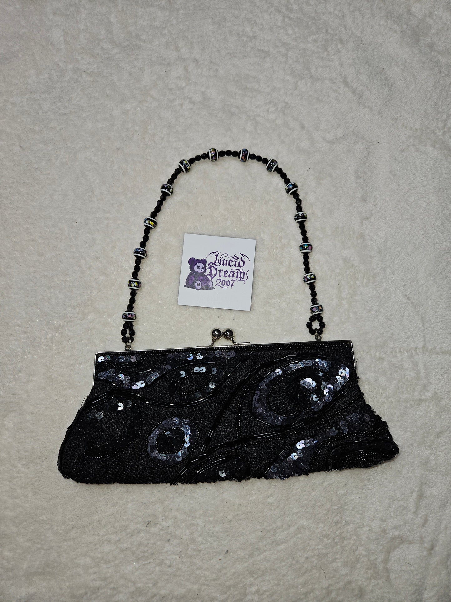 Bandolera negra con perlas y lentejuelas
