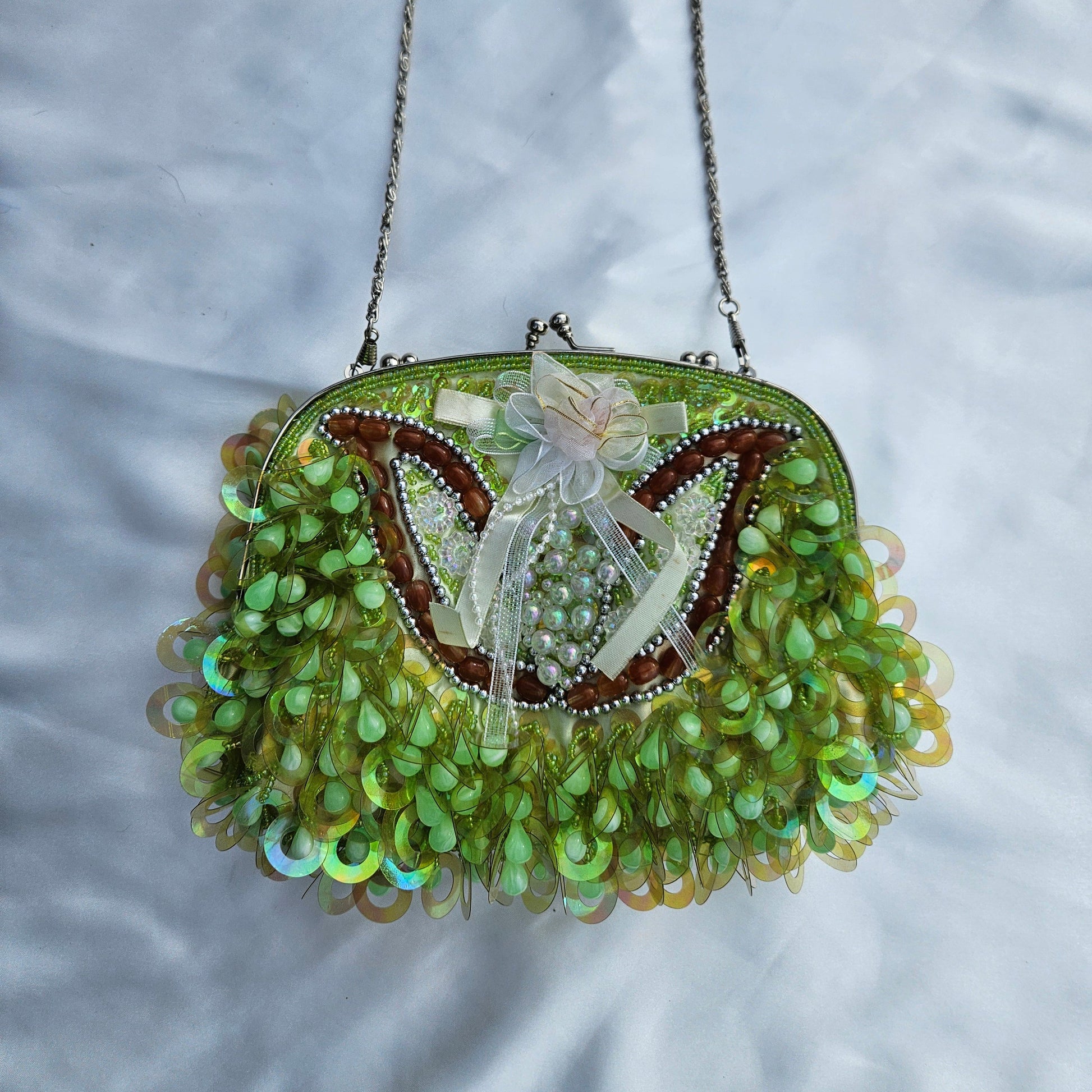 Vintage green sequin shoulder bag with floral detail and iridescent fringe, whimsical fairycore Y2K statement purse, dreamy garden aesthetic by Lucid Dream 2007.