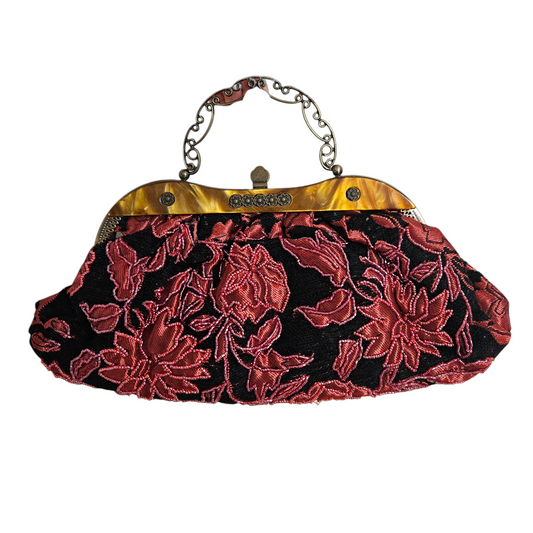 Vintage red and black floral evening bag with ornate metal frame and chain strap, romantic whimsigoth accessory with dramatic Y2K fairycore evening vibes.