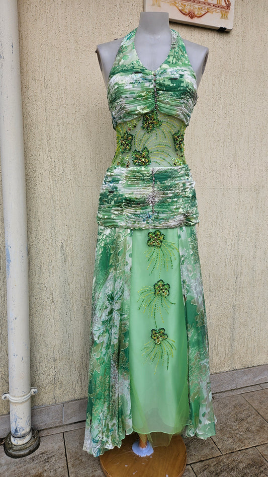 Vintage Y2K green floral halter prom dress with heavy beadwork on the mesh midriff and matching skirt panels, on a mannequin. Fairycore formal gown.