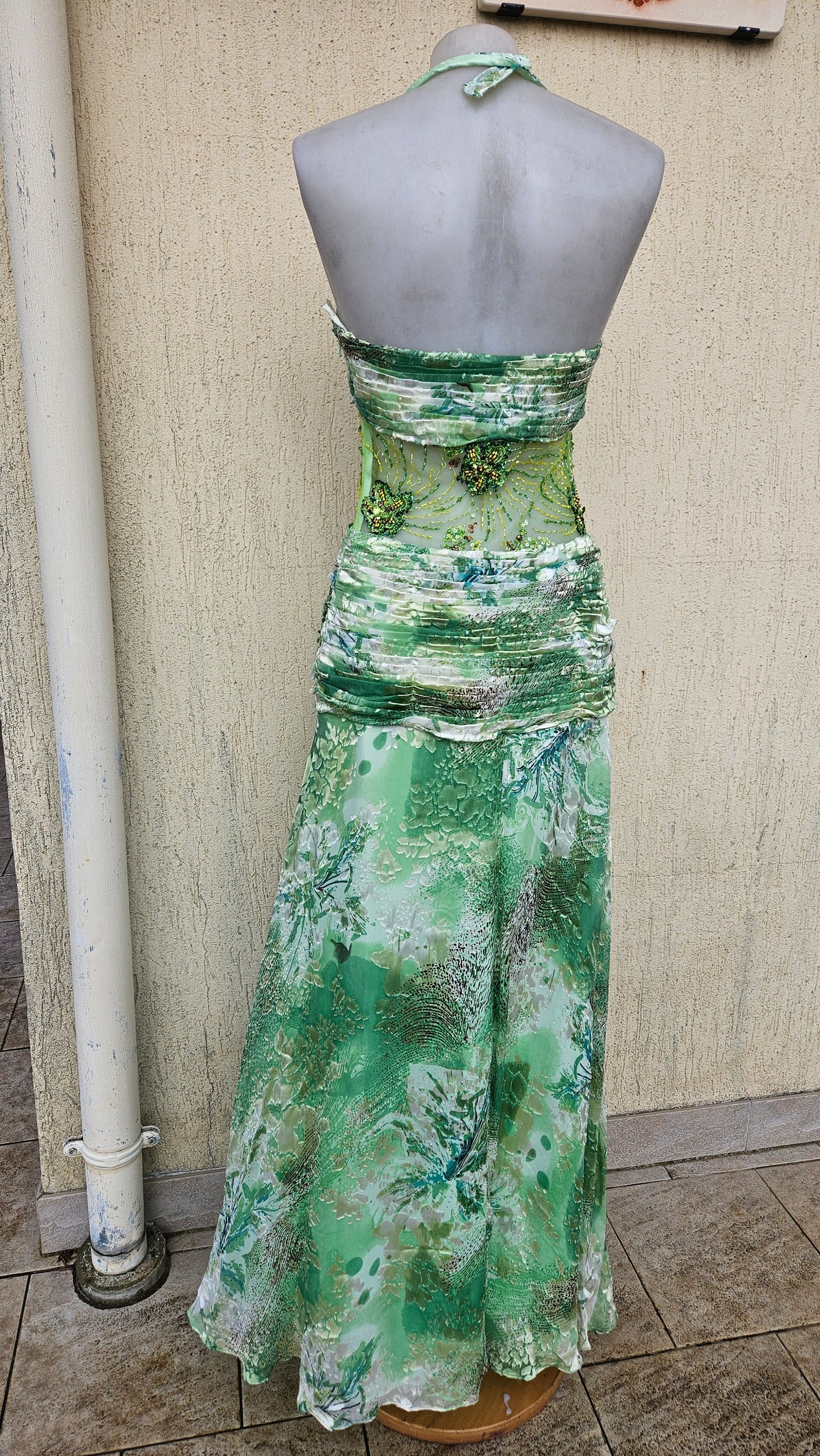 Green silk dress embroidered with beads