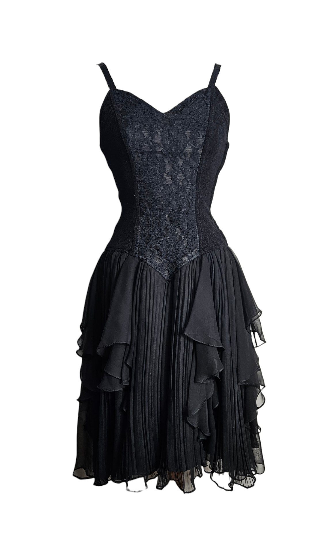 Vintage black cocktail dress with a floral lace bodice and a tiered, pleated ruffle skirt on a mannequin.
