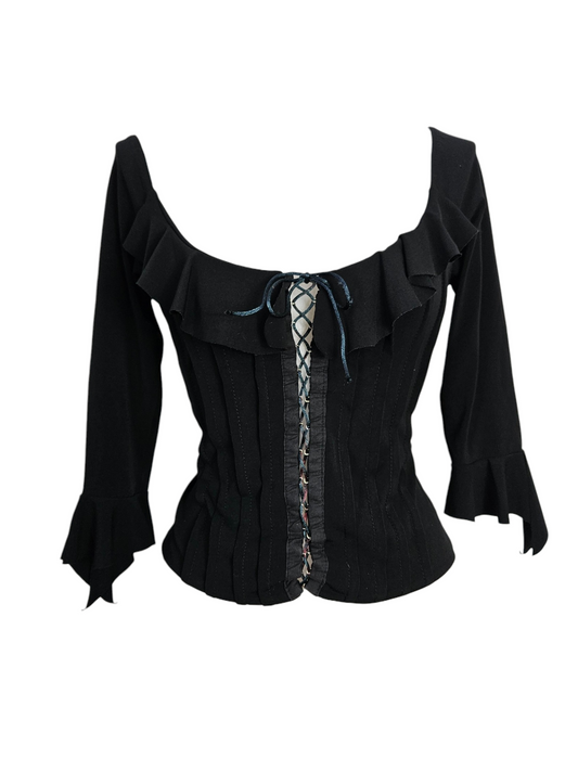 Black milkmaid top with ruffles, lace-up front corset detail, and flared sleeves. Gothic coquette aesthetic, vintage long-sleeve blouse on a mannequin.