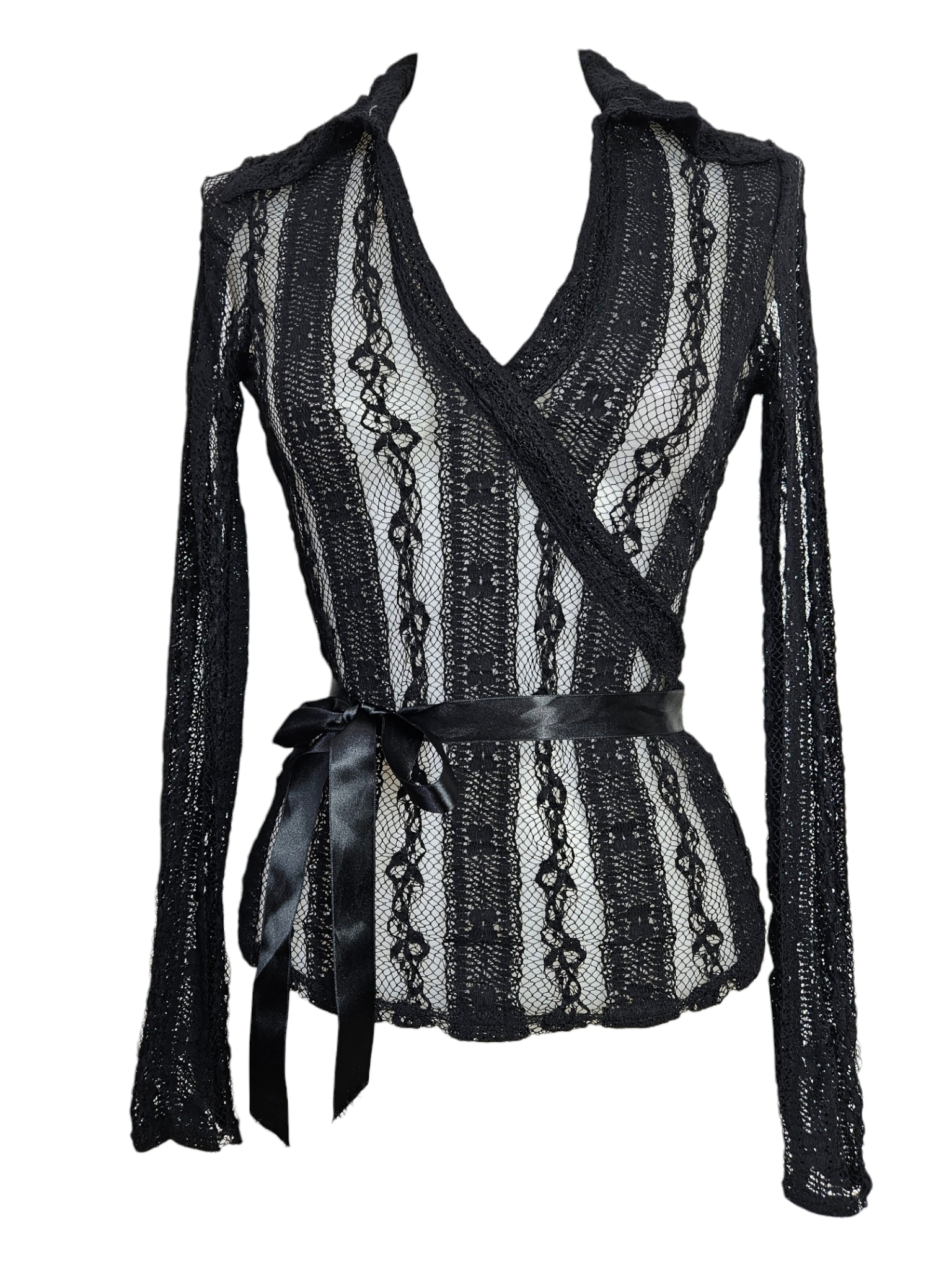 Black sheer lace wrap top with vertical patterns, long sleeves, and a satin ribbon waist tie. Gothic coquette style, vintage lace blouse on a mannequin.