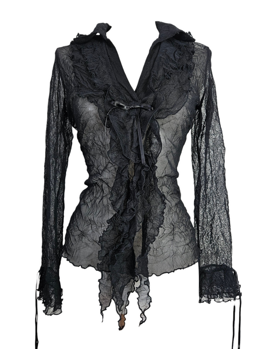 Black sheer textured mesh top with tiered ruffles, front ribbon tie, and flared cuffs. Gothic whimzygoth aesthetic, vintage long-sleeve blouse on a mannequin.