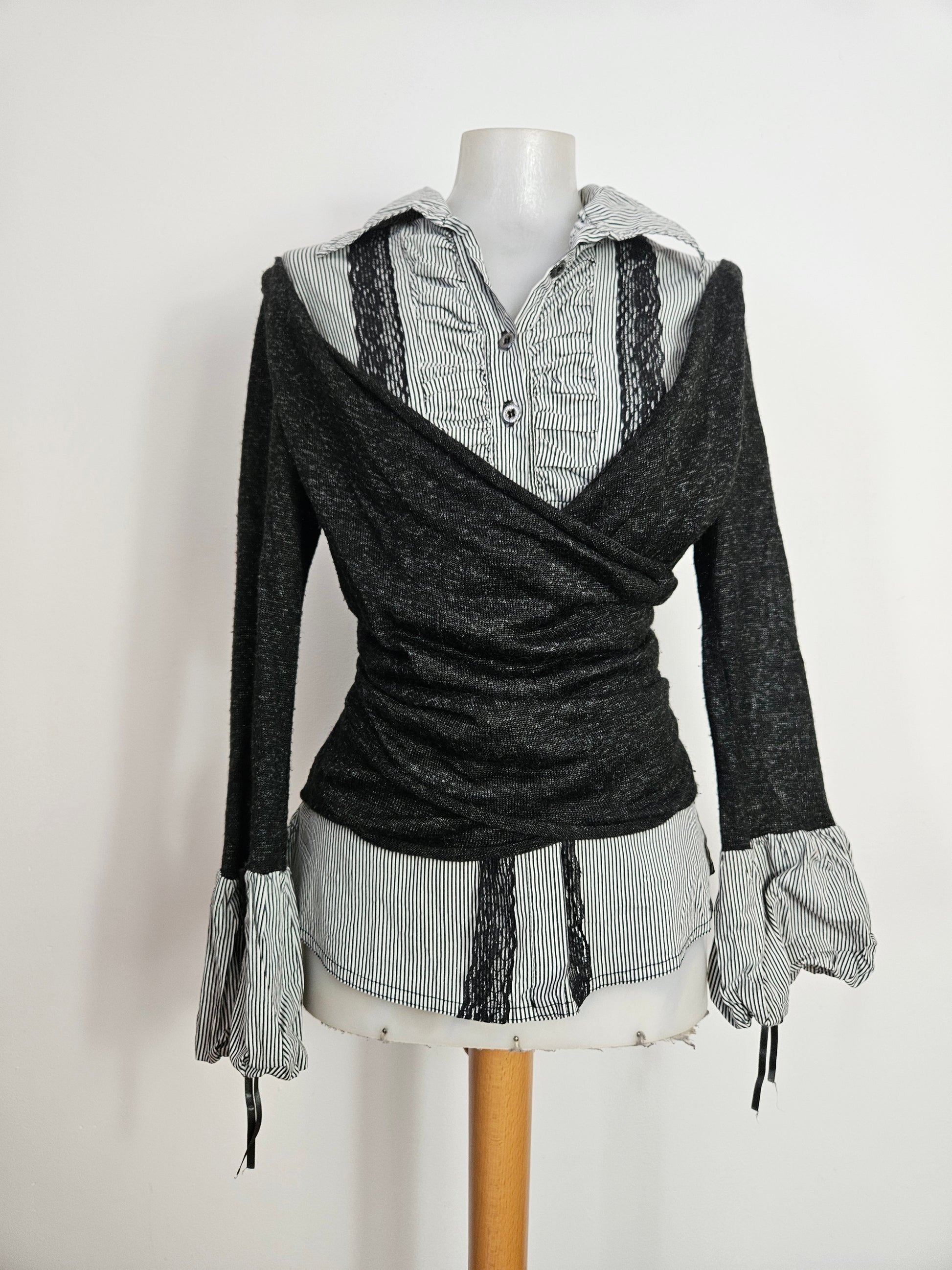 Y2K layered top featuring a striped button-down shirt with black lace trim and an attached grey wrap-style cardigan overlay.