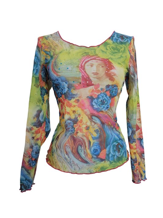 Vibrant sheer mesh top with Renaissance portrait, blue roses, and rhinestone details. Colorful Y2K long-sleeve with lettuce hem on a mannequin.