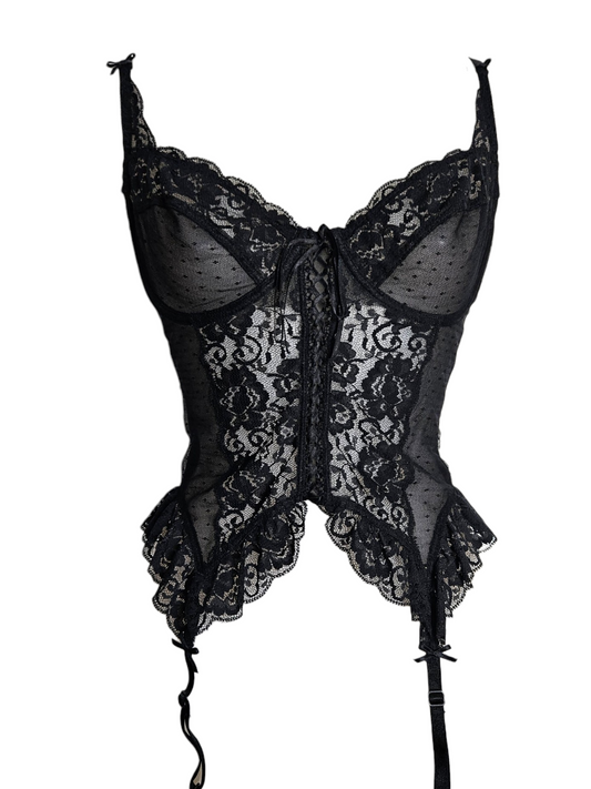 Vintage black sheer lace corset with garter straps and ruffled hem by Lucid Dream 2007. Features a front lace-up detail, perfect for a Y2K aesthetic.