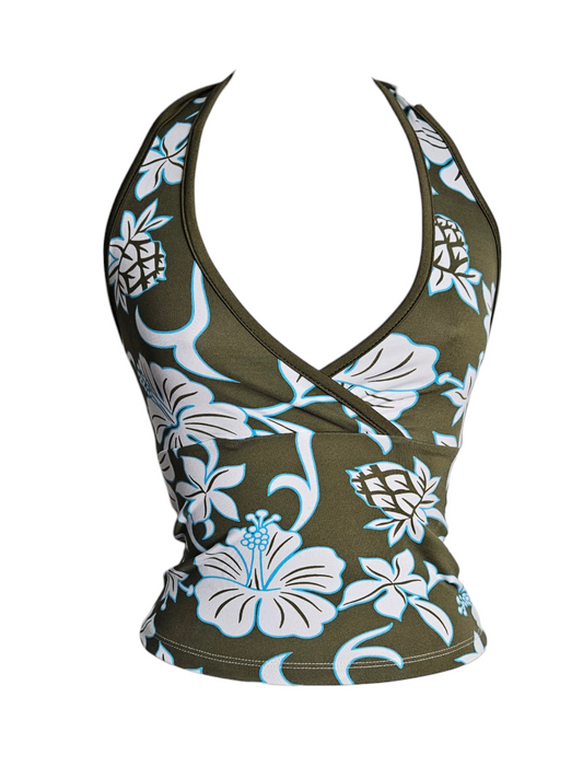 A vintage Y2K olive green halter top with a deep V-neck and tie neck strap, featuring a large white and blue floral and pineapple pattern.