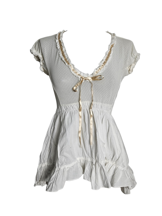 White ruffled babydoll top, milkmaid style with satin bow and lace trim.