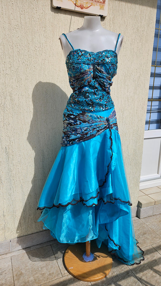 Turquoise blue sequined mermaid dress with ruffled tiered skirt, paisley print accents, and spaghetti straps for vintage evening wear or prom style.