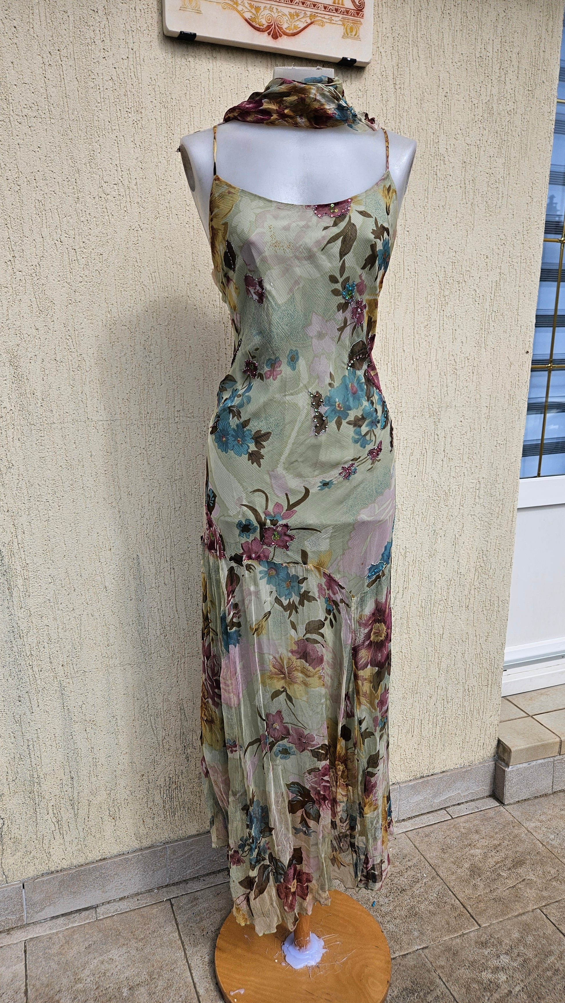 Vintage Y2K floral silk slip dress with spaghetti straps and beaded accents. Shabby chic 90s aesthetic midi dress on a mannequin.