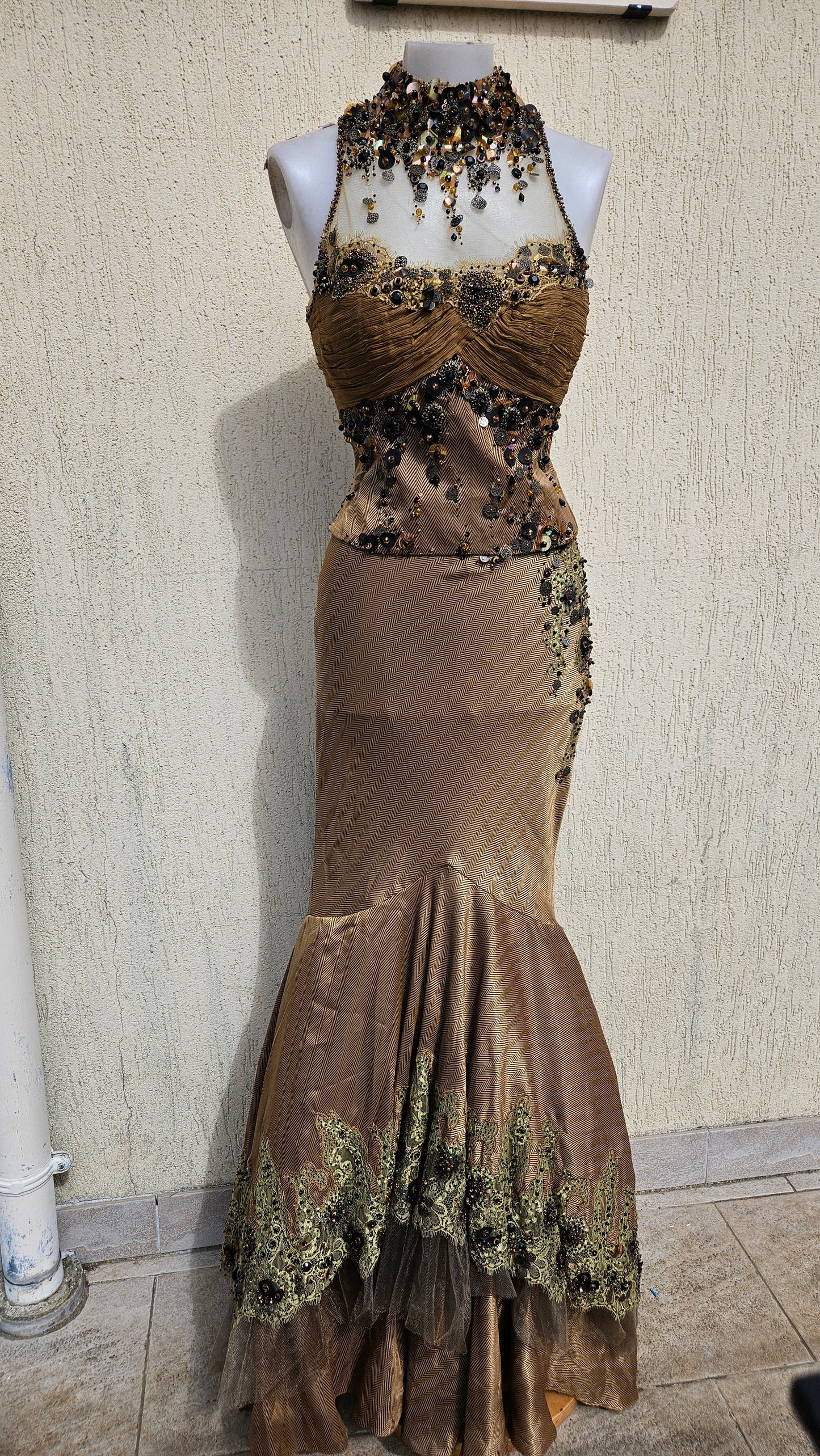 Bronze mermaid evening gown with halter neck, sequin & bead embellishments, and lace trim hem. Elegant high collar formal dress for a gothic or vintage look.