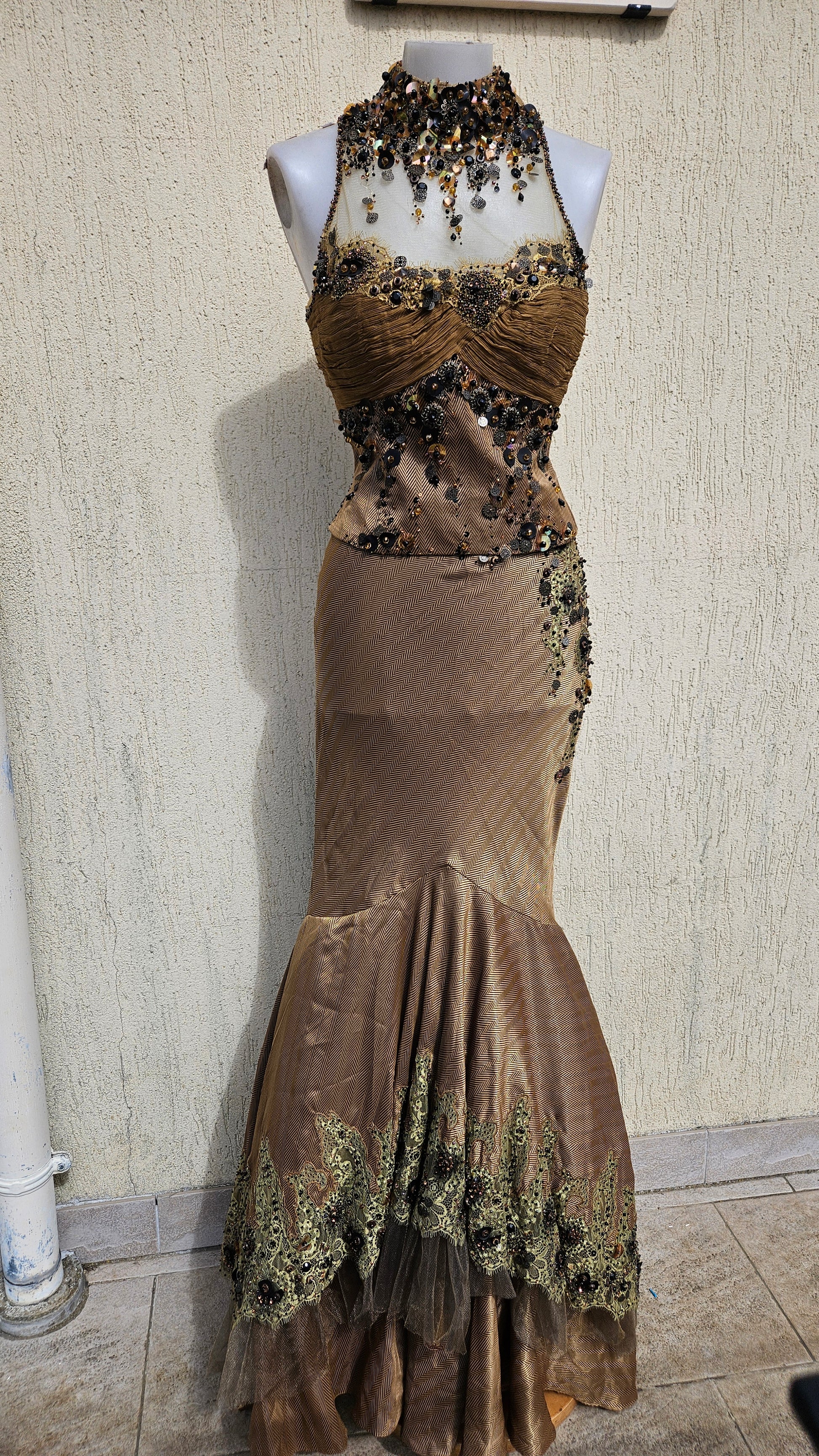 Bronze mermaid evening gown with halter neck, sequin & bead embellishments, and lace trim hem. Elegant high collar formal dress for a gothic or vintage look.