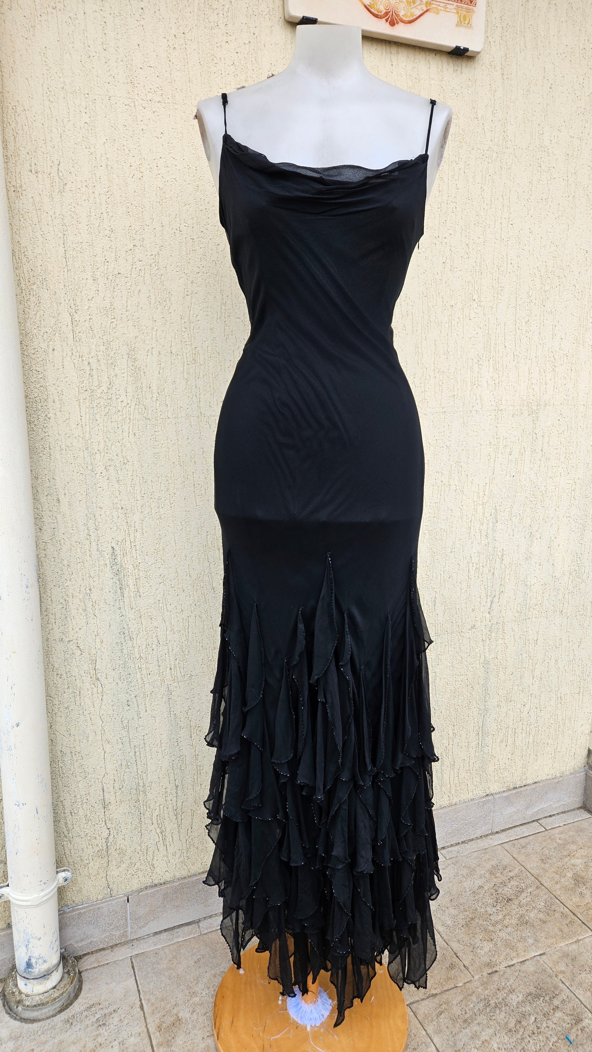 Vintage Y2K black maxi slip dress with a cowl neck and thin straps. Features a dramatic tiered ruffle mermaid skirt. Classic gothic glam evening gown.