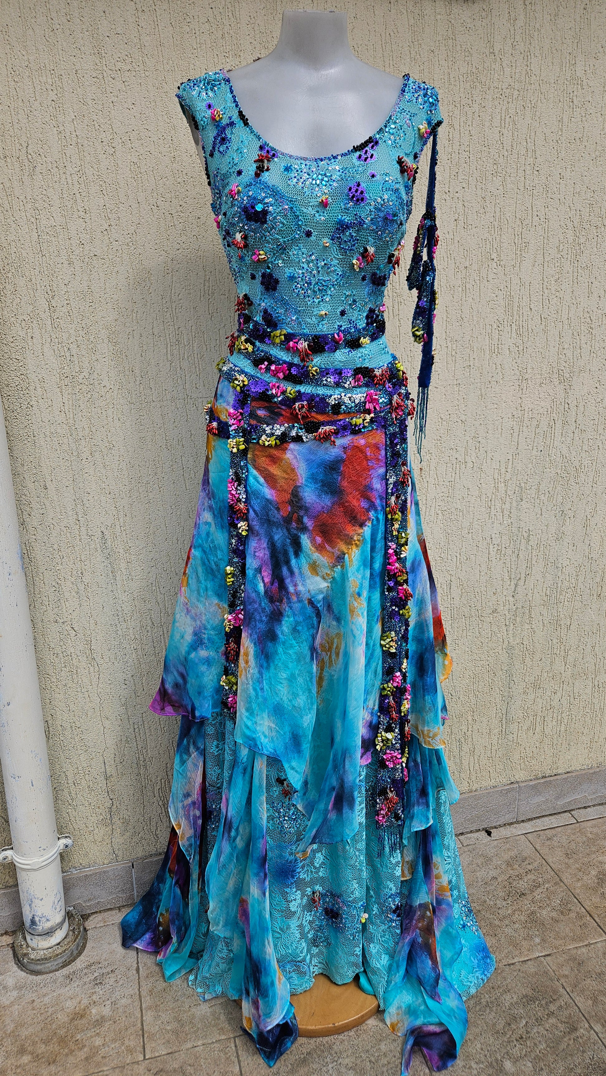 Elevate your style with this vibrant Y2K beaded maxi dress. Featuring a sequined bodice and tie-dye layered skirt, it's the ultimate Lucid Dream 2007 statement.