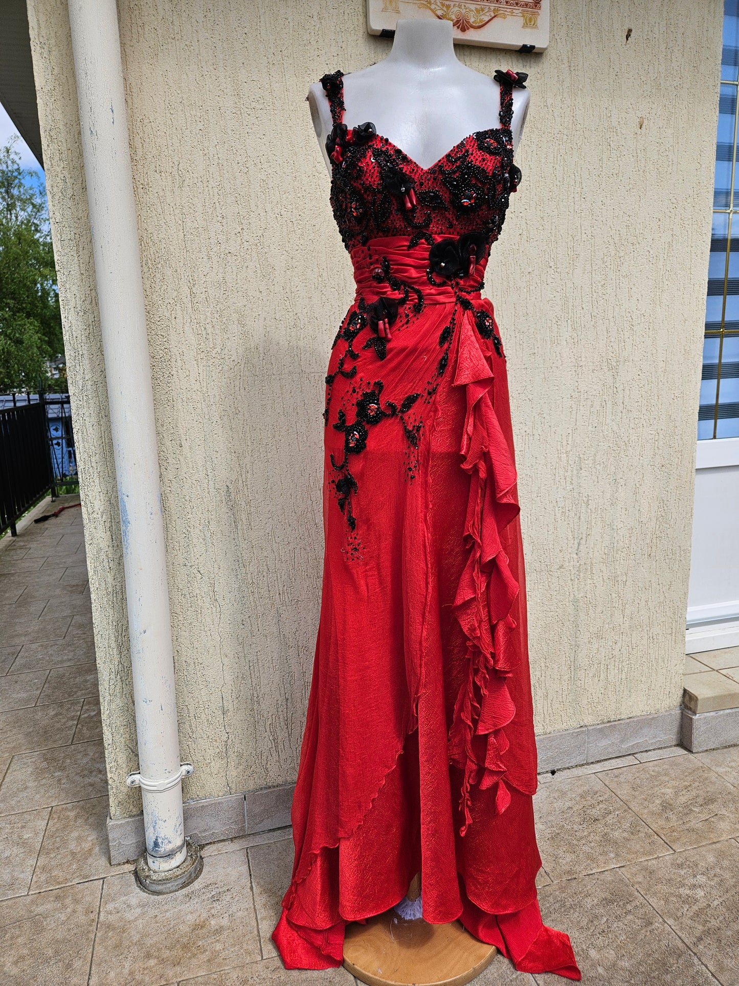 Stunning vintage red gown with intricate black beaded embroidery and ruffled details. Perfect for a Y2K-inspired evening look. Shop Lucid Dream 2007.