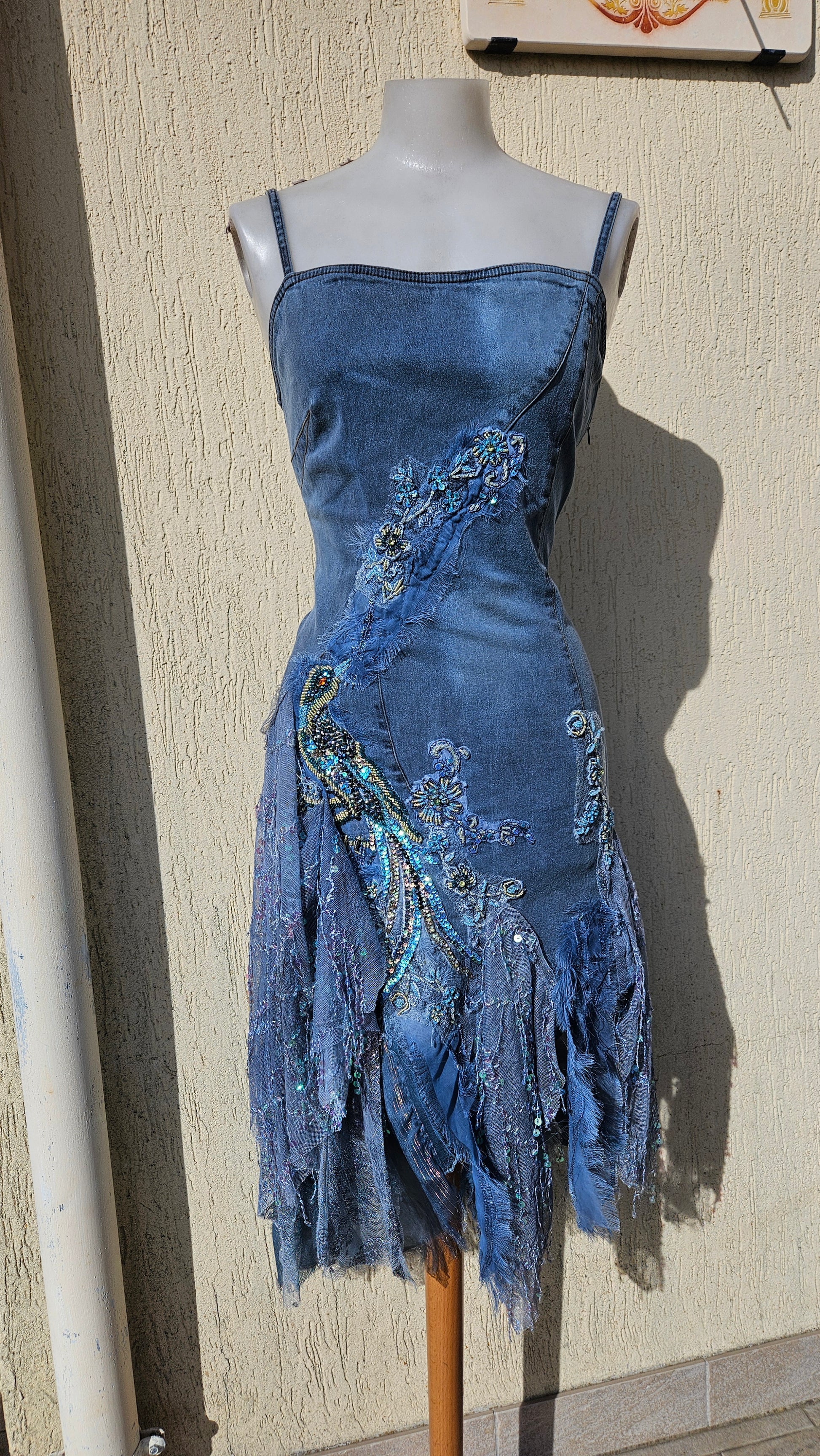 Y2K upcycled denim dress. Intricate beaded peacock embroidery & tattered lace/patchwork hem. Boho grunge-glam vibes. One of a kind piece.