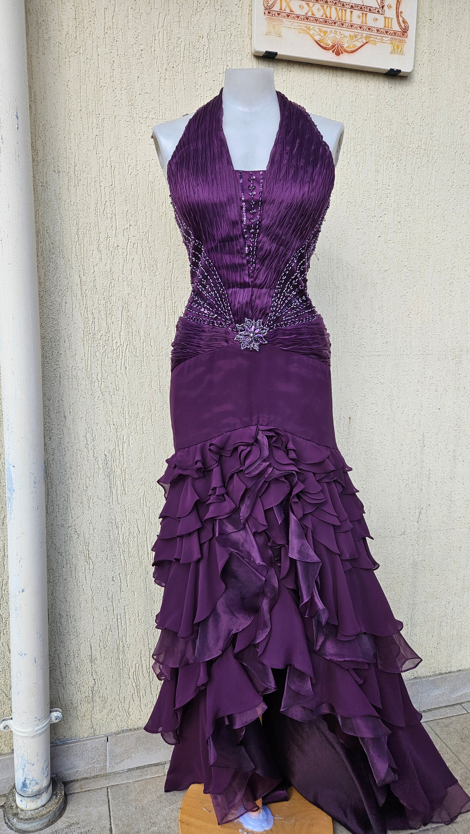 Y2K grunge-glam deep purple halter dress. Ruched bodice with intricate beaded floral waist detail. Tiered high-low ruffle skirt. Perfect dramatic emo/goth prom look.