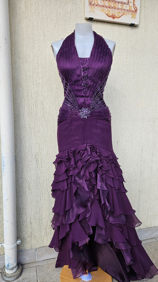 Y2K grunge-glam deep purple halter dress. Ruched bodice with intricate beaded floral waist detail. Tiered high-low ruffle skirt. Perfect dramatic emo/goth prom look.