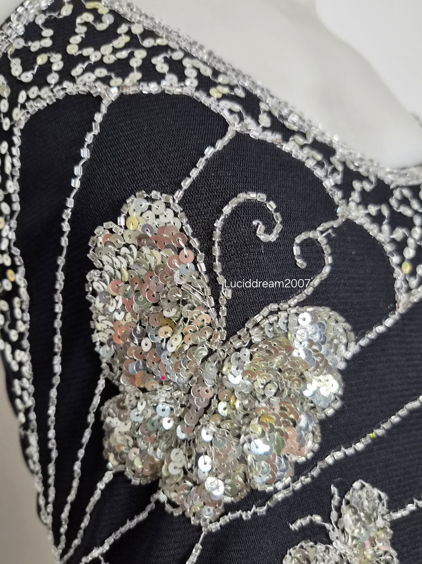 Asymmetric top with butterfly embroidery