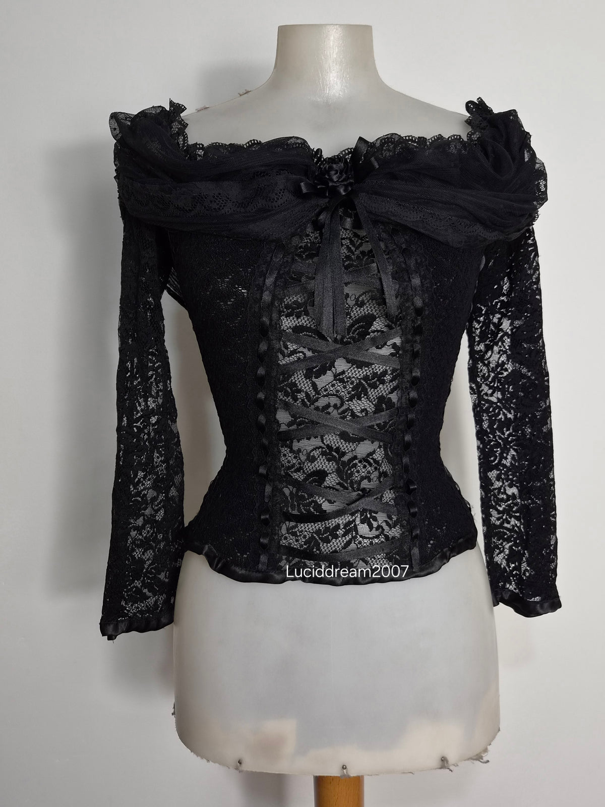 Black top with lace and floral details
