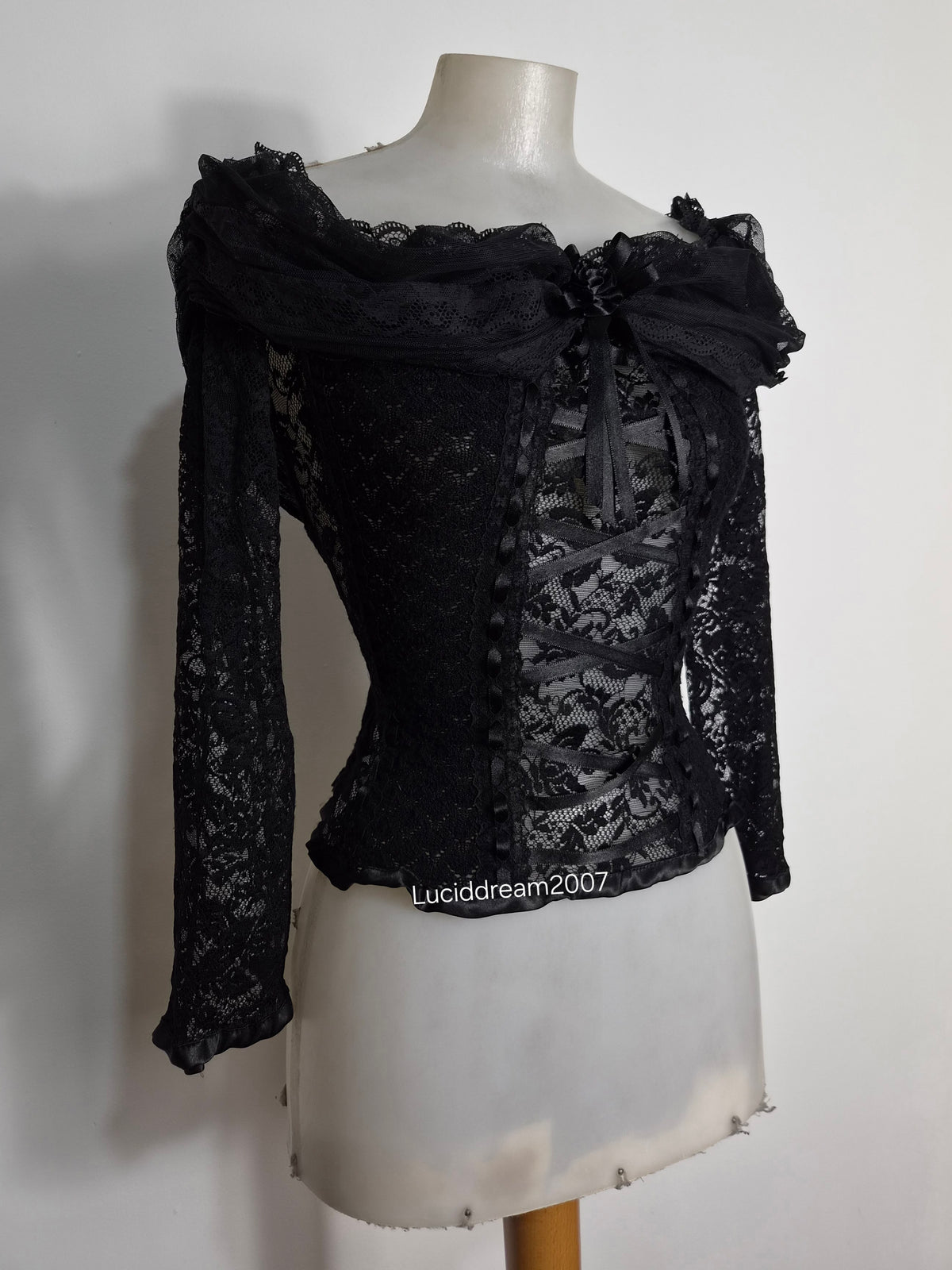 Black top with lace and floral details