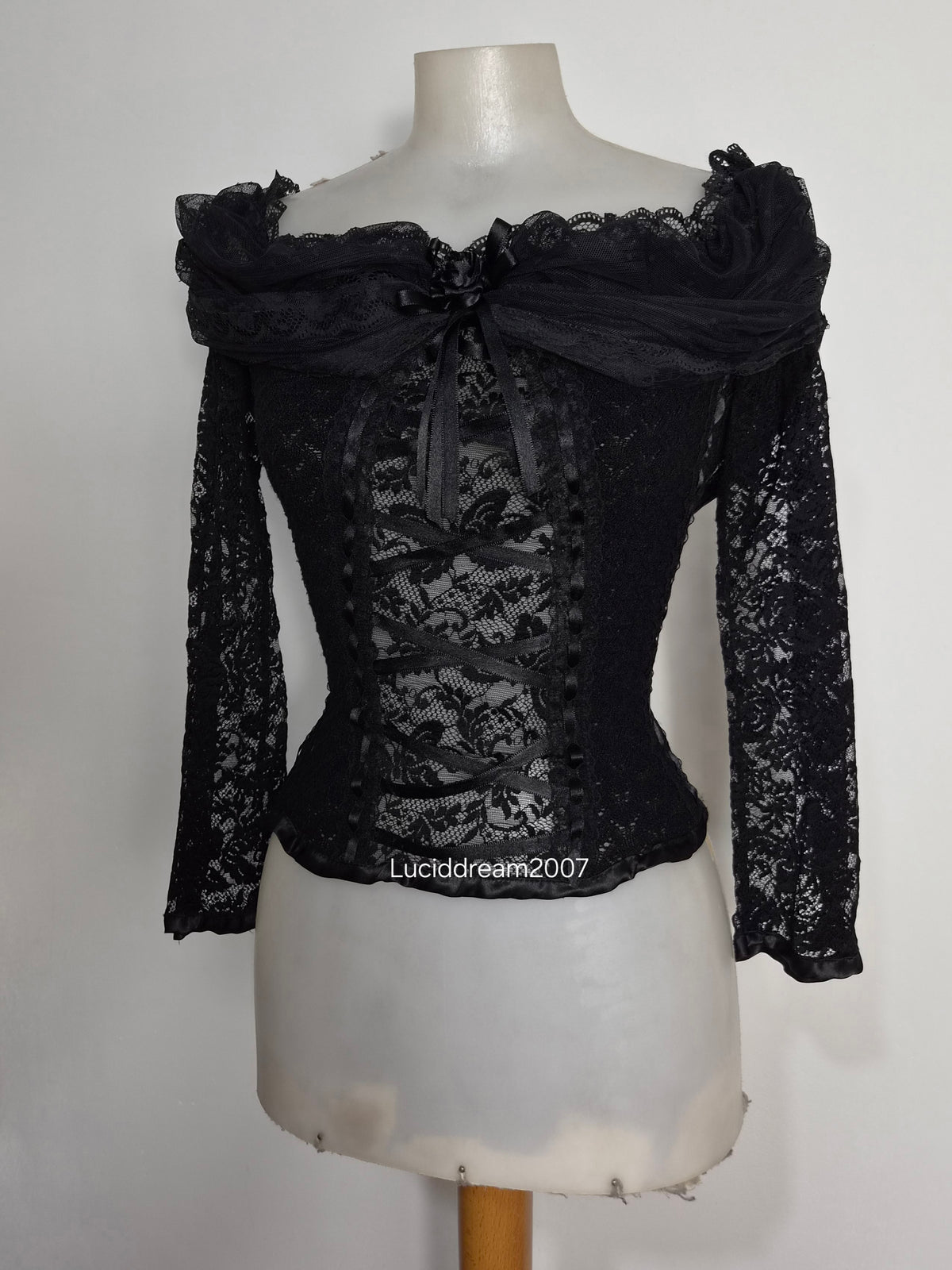 Black top with lace and floral details