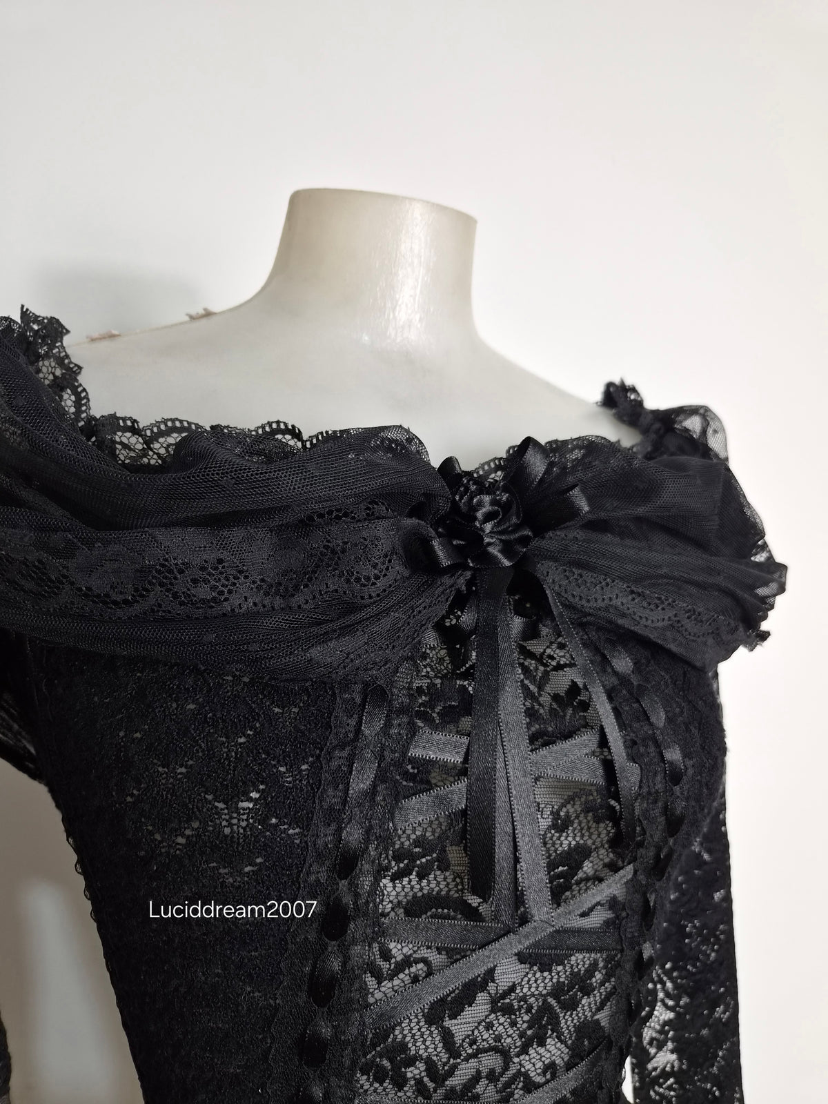 Black top with lace and floral details