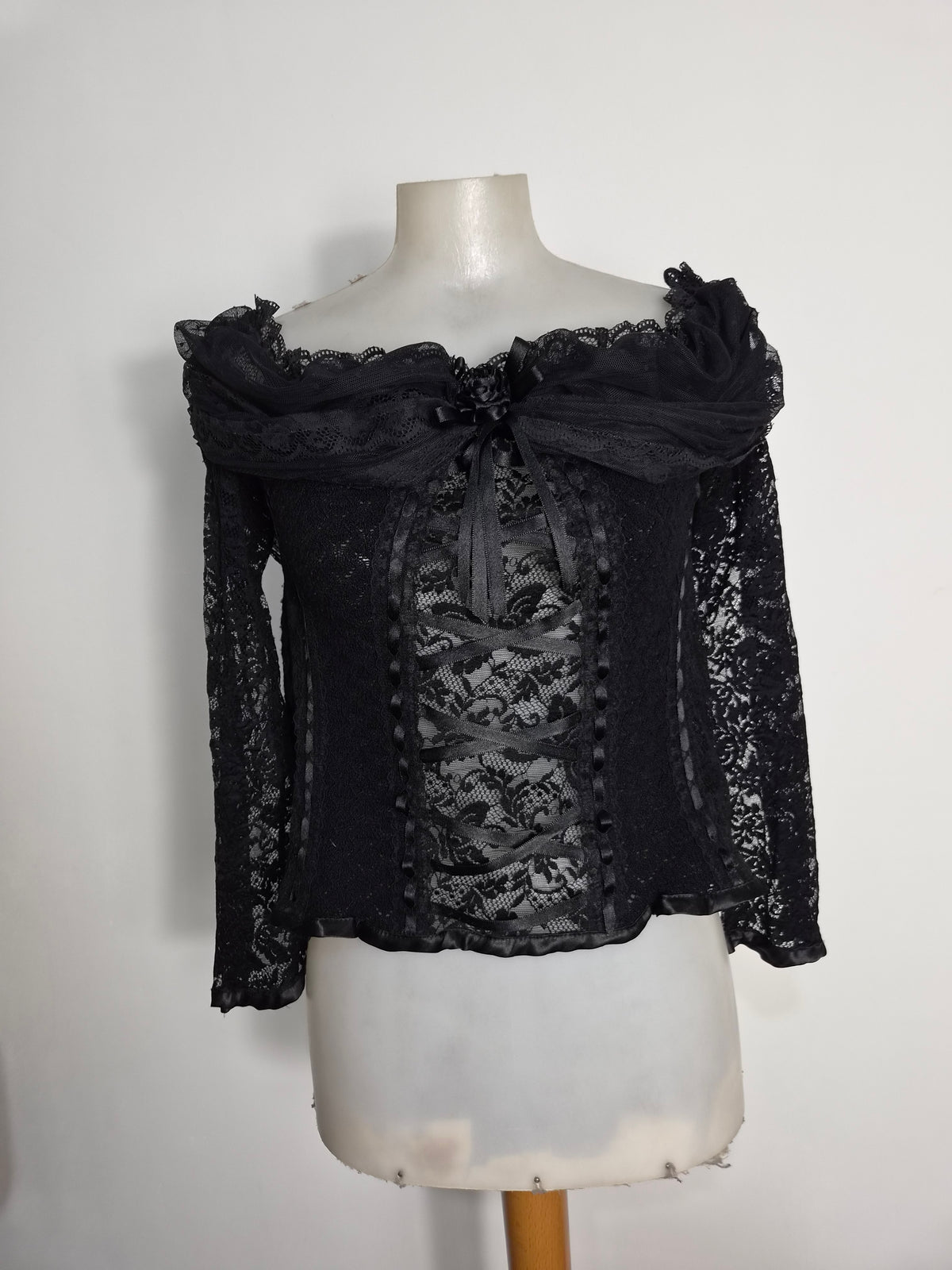 Black top with lace and floral details