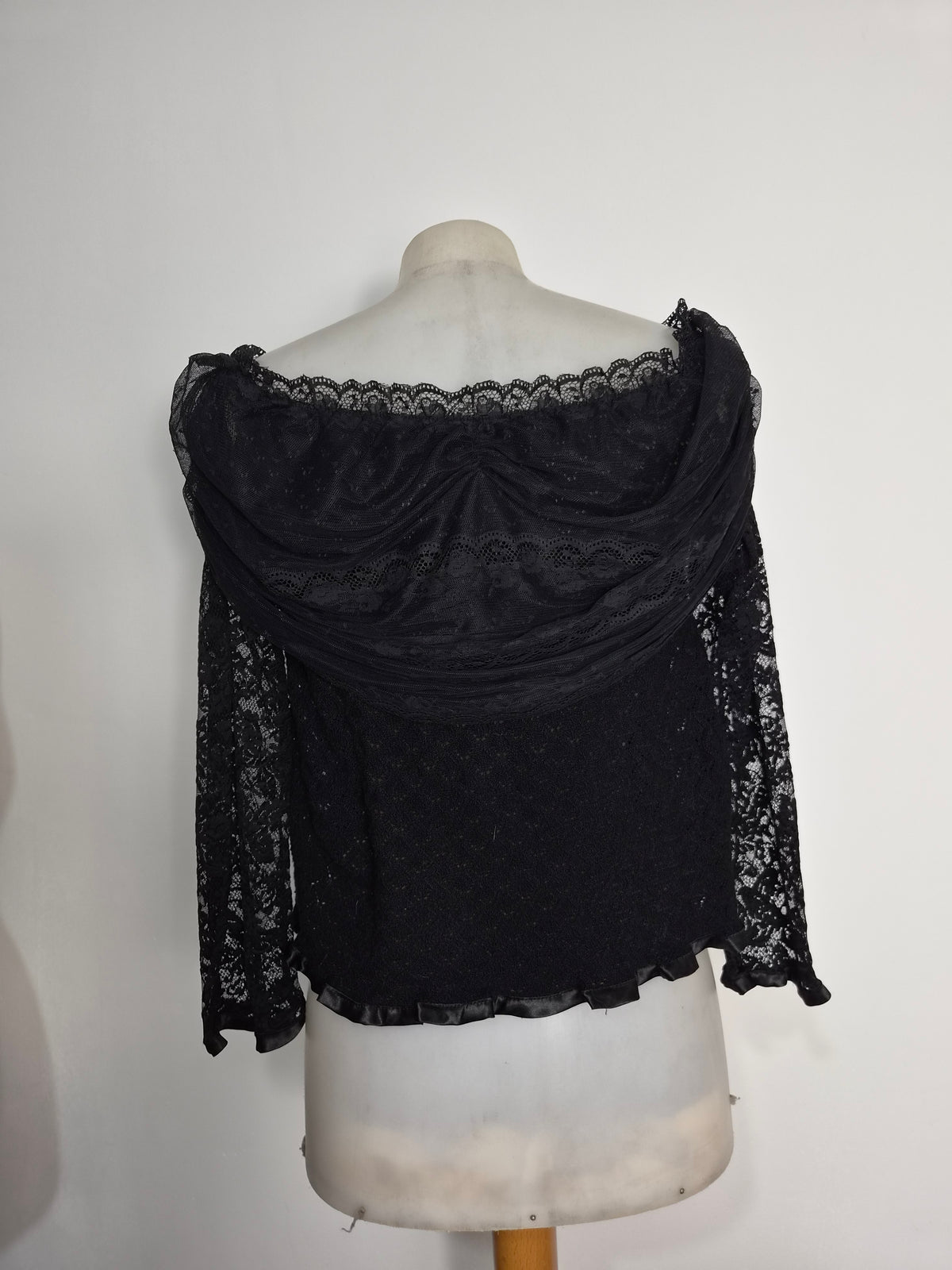 Black top with lace and floral details