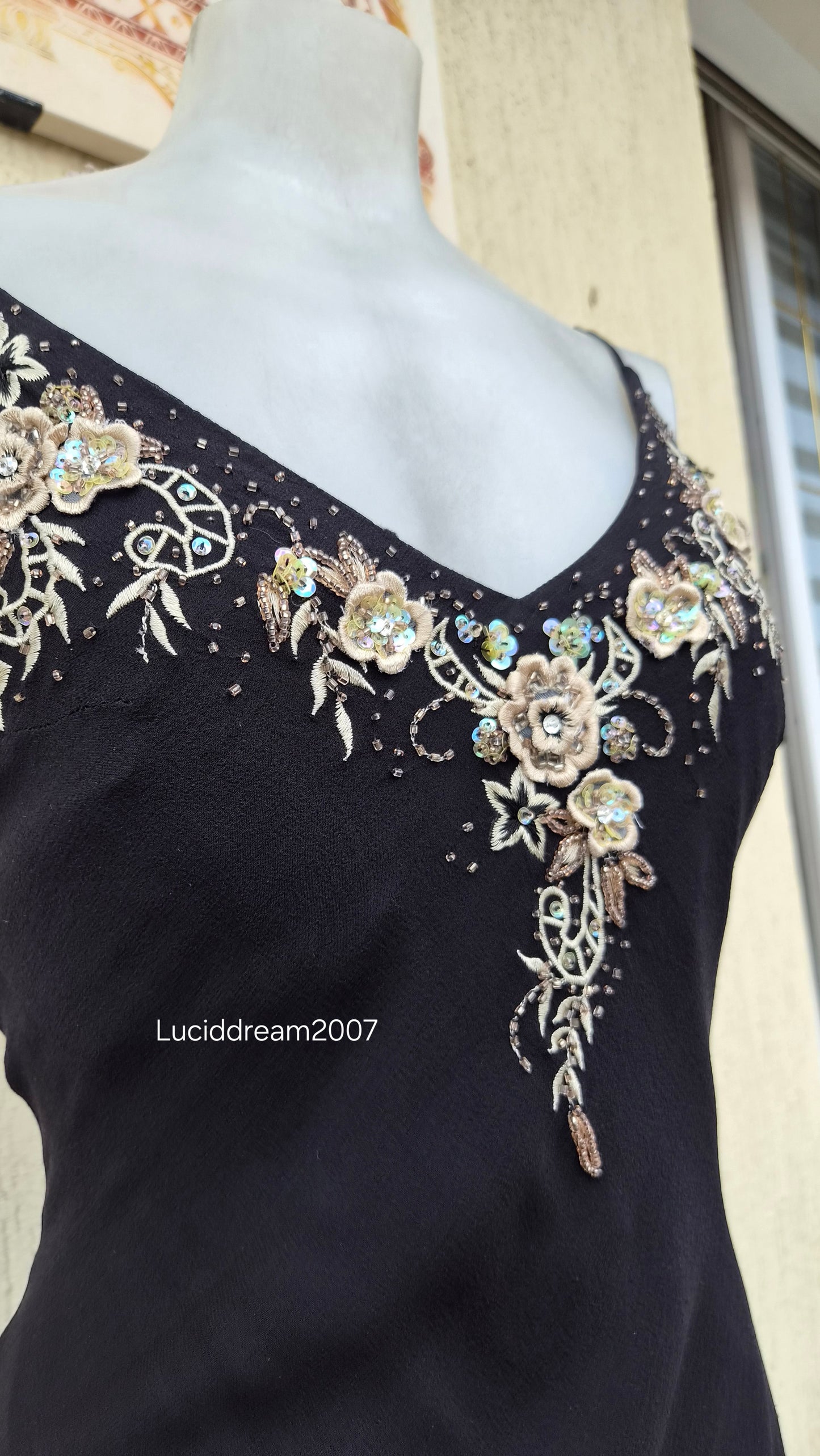 Black silk dress with embroidered details