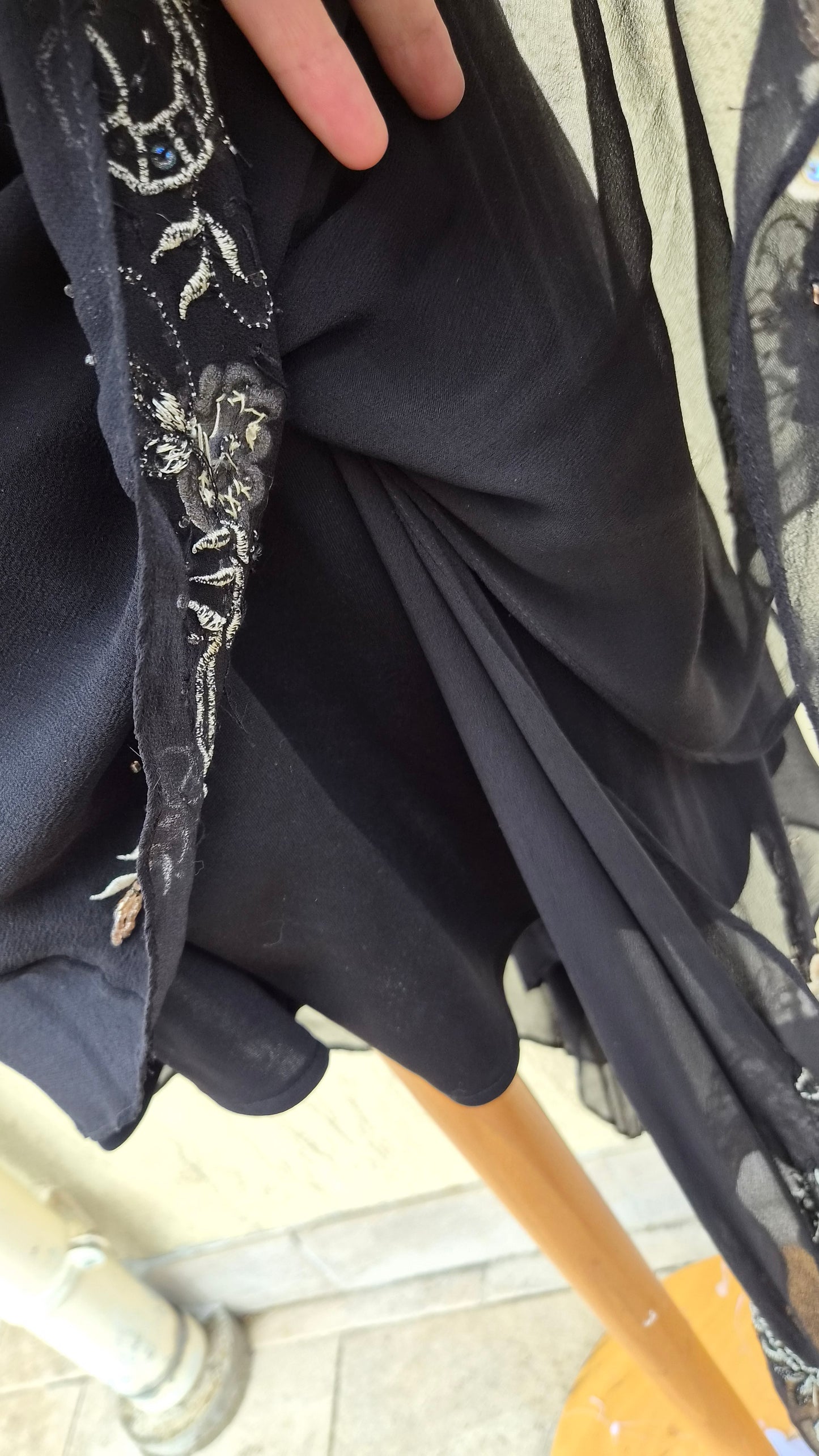 Black silk dress with embroidered details
