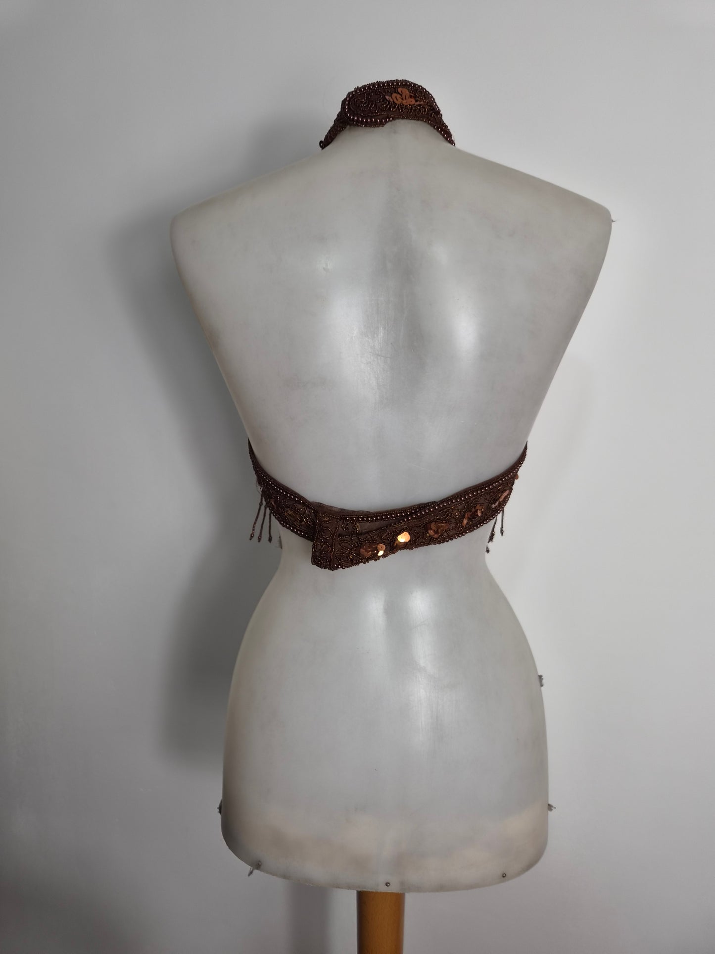 Brown backless top embroidered with beads and sequins