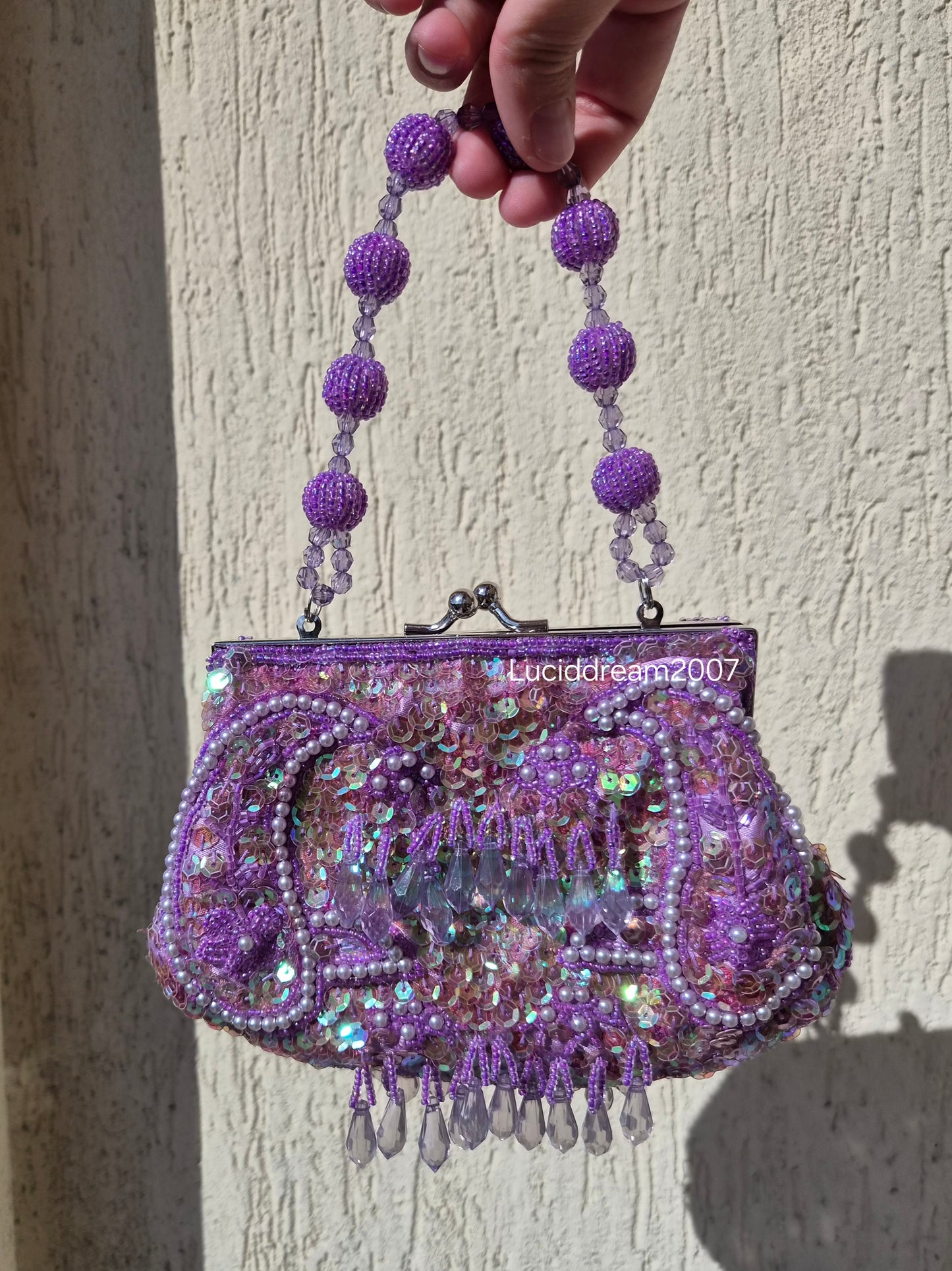 Small embroidered purple pouch