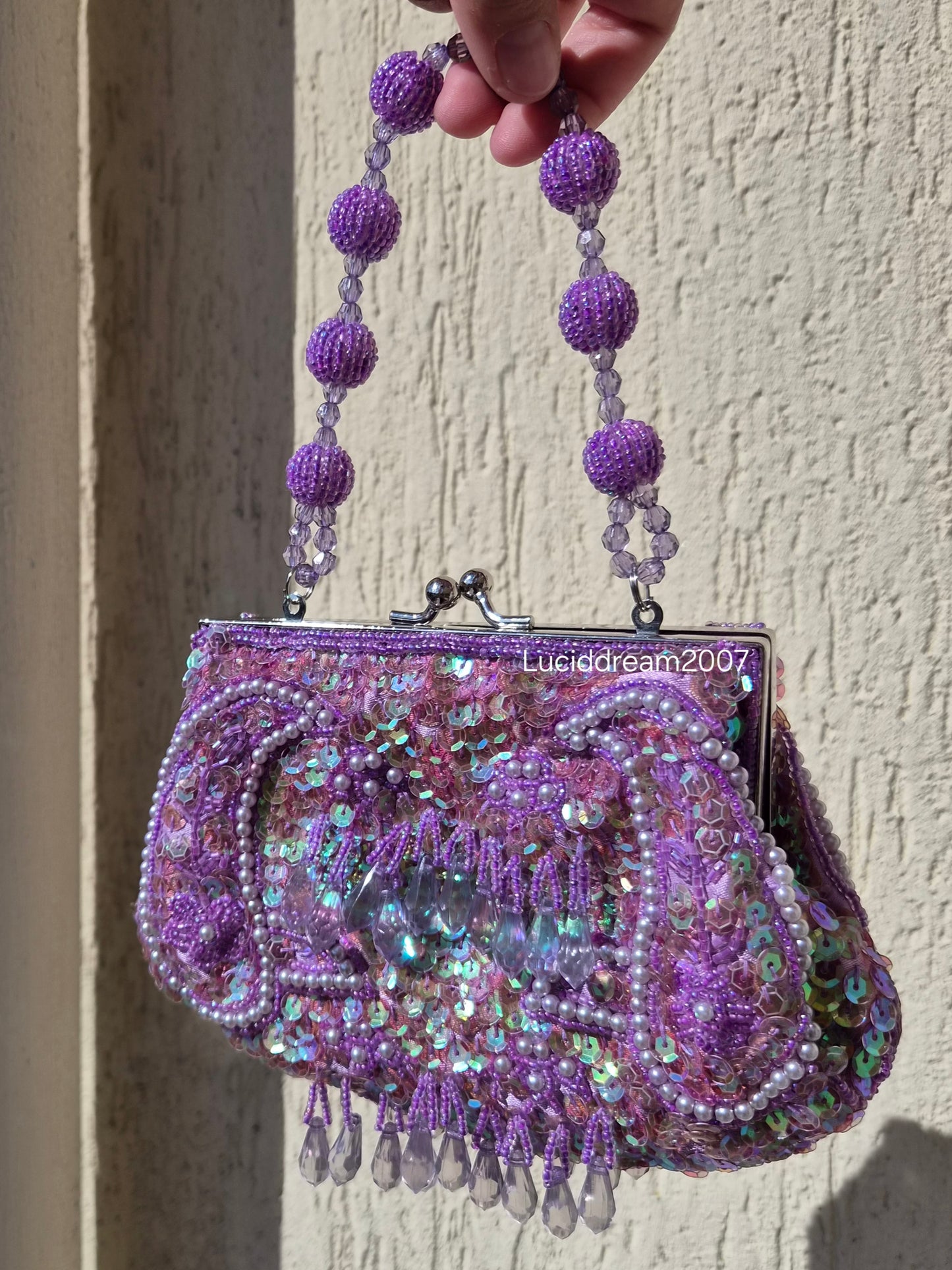 Small embroidered purple pouch