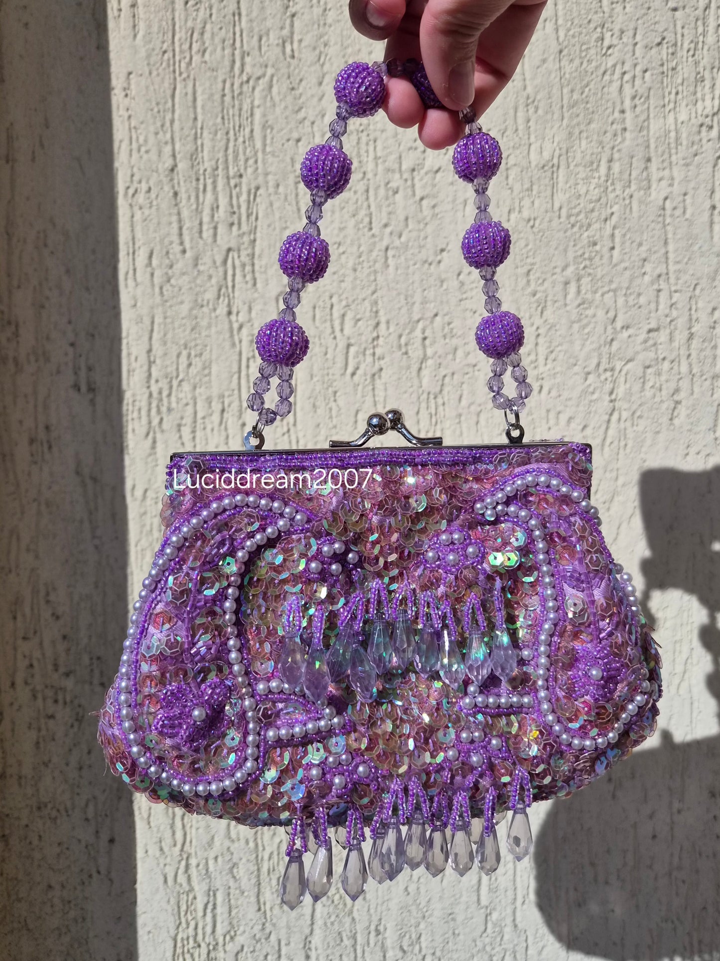 Small embroidered purple pouch