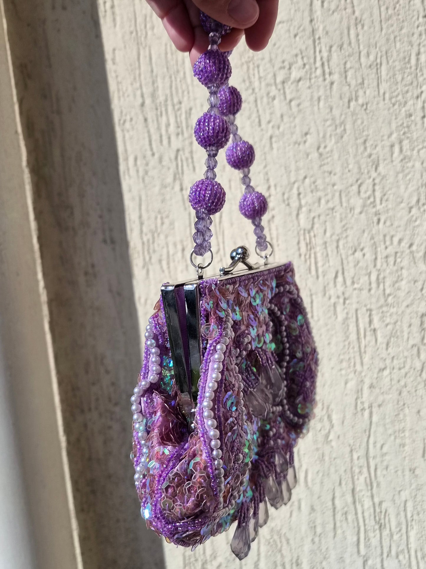 Small embroidered purple pouch