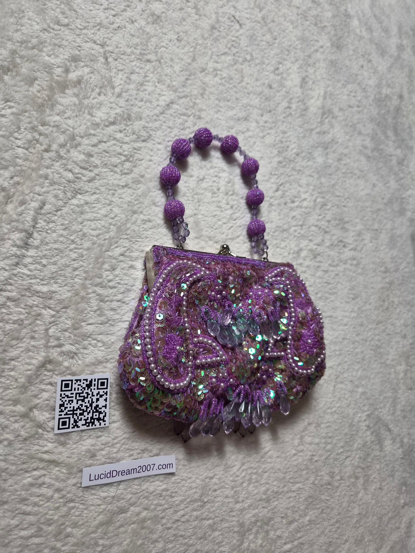 Small embroidered purple pouch
