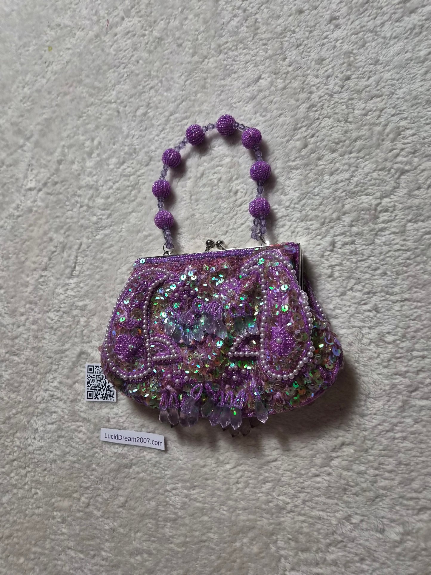 Small embroidered purple pouch