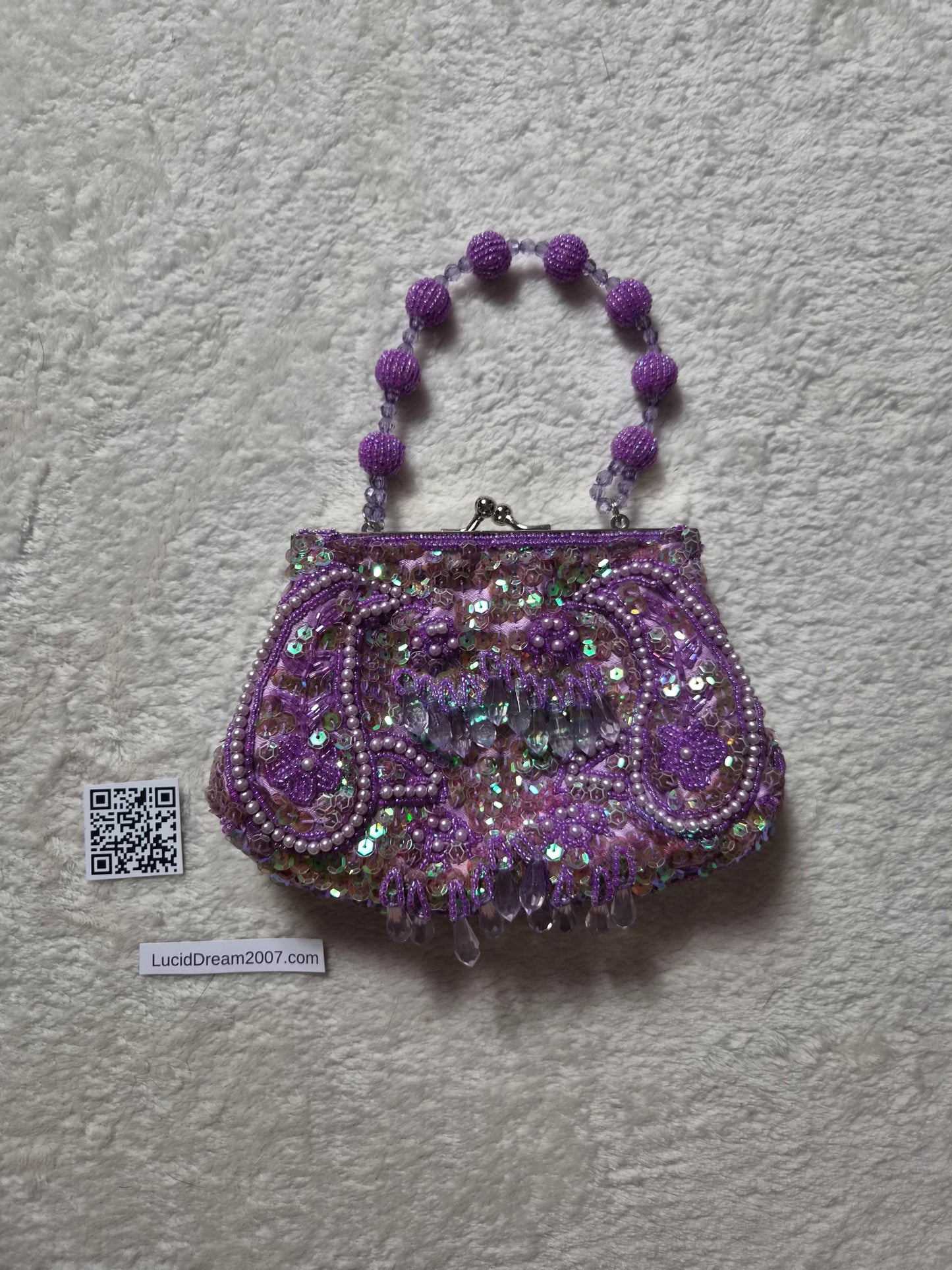 Small embroidered purple pouch