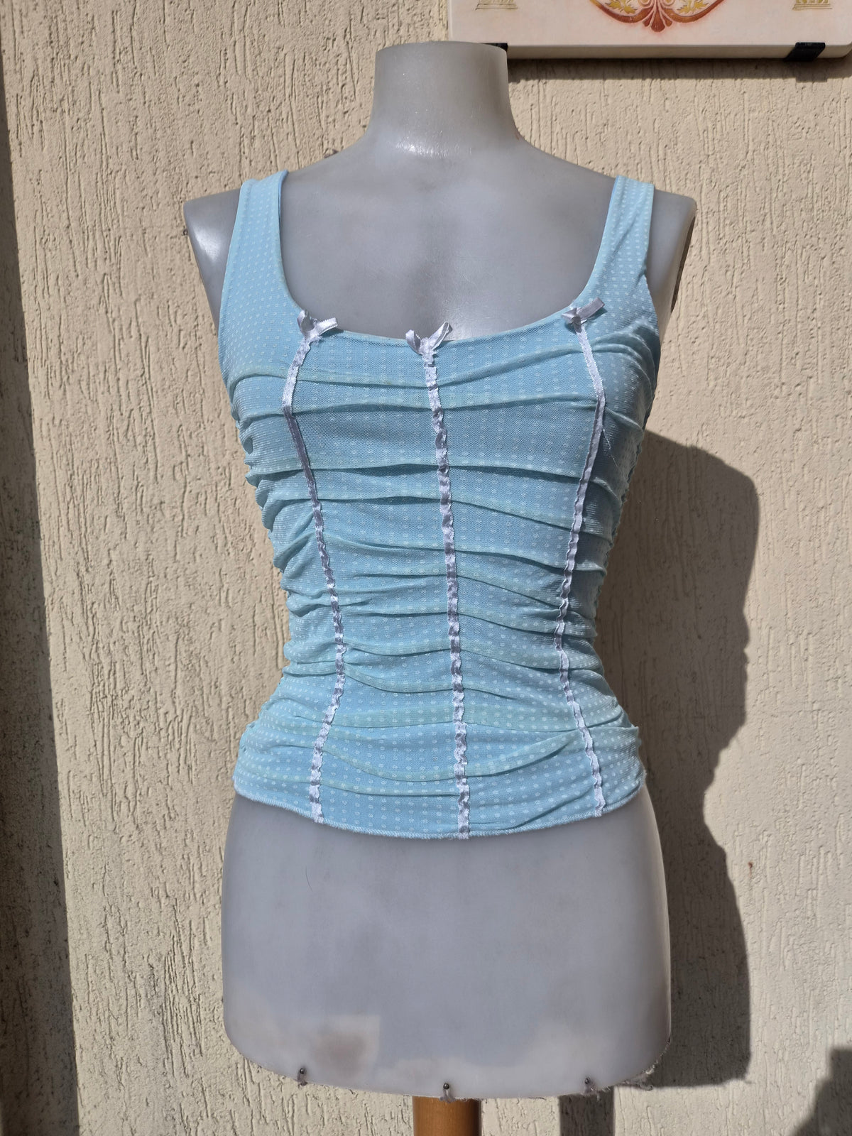 Blue pleated voile top with polka dots