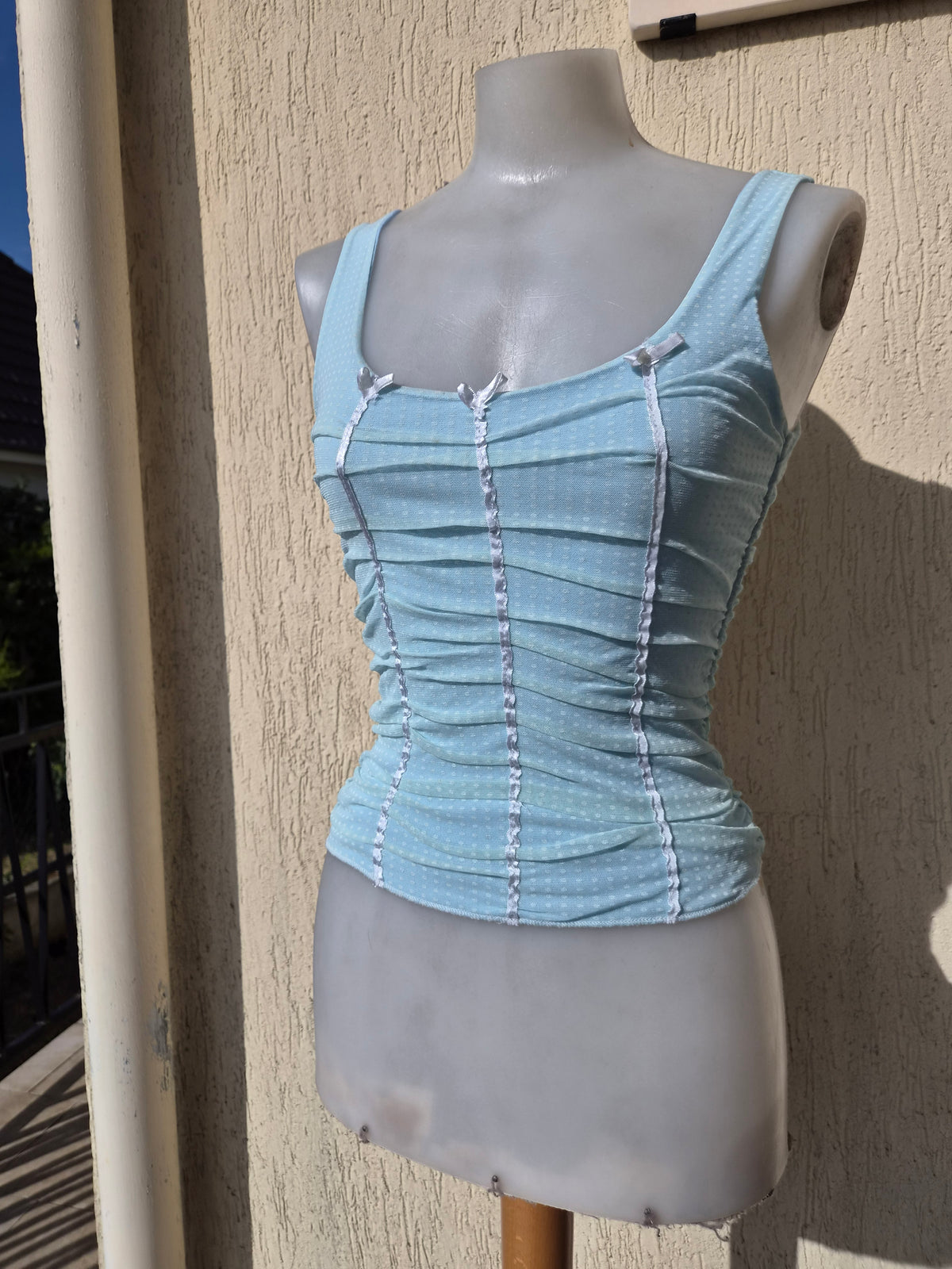 Blue pleated voile top with polka dots