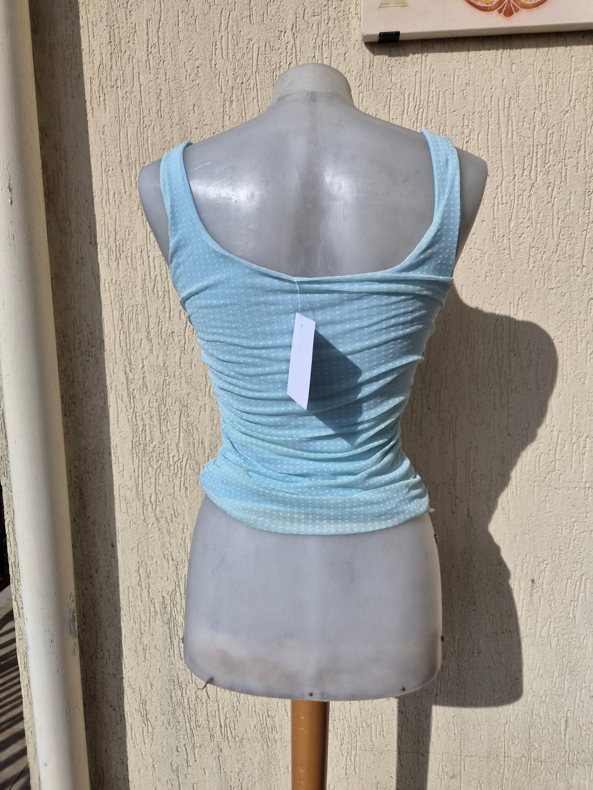 Blue pleated voile top with polka dots