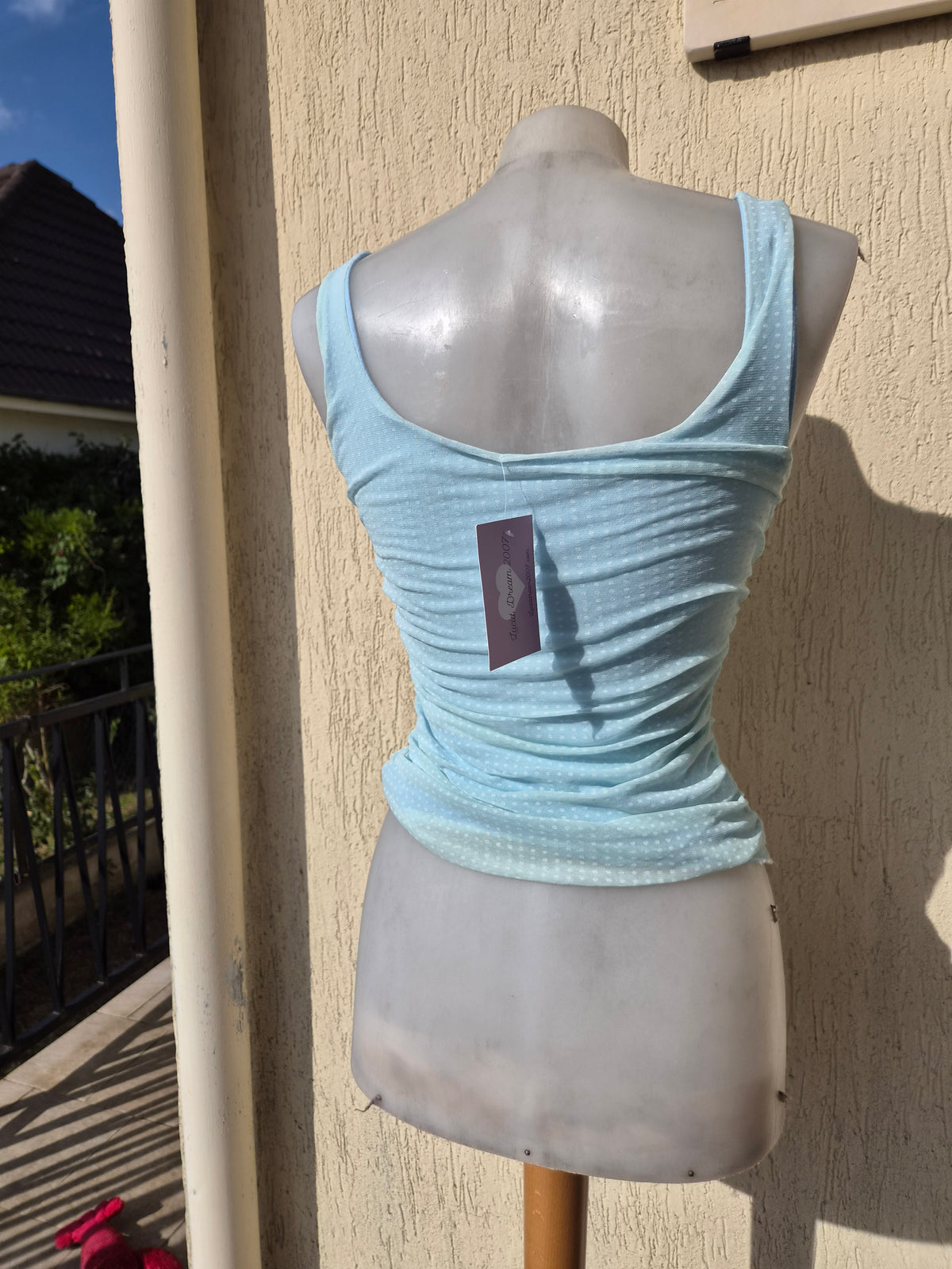 Blue pleated voile top with polka dots