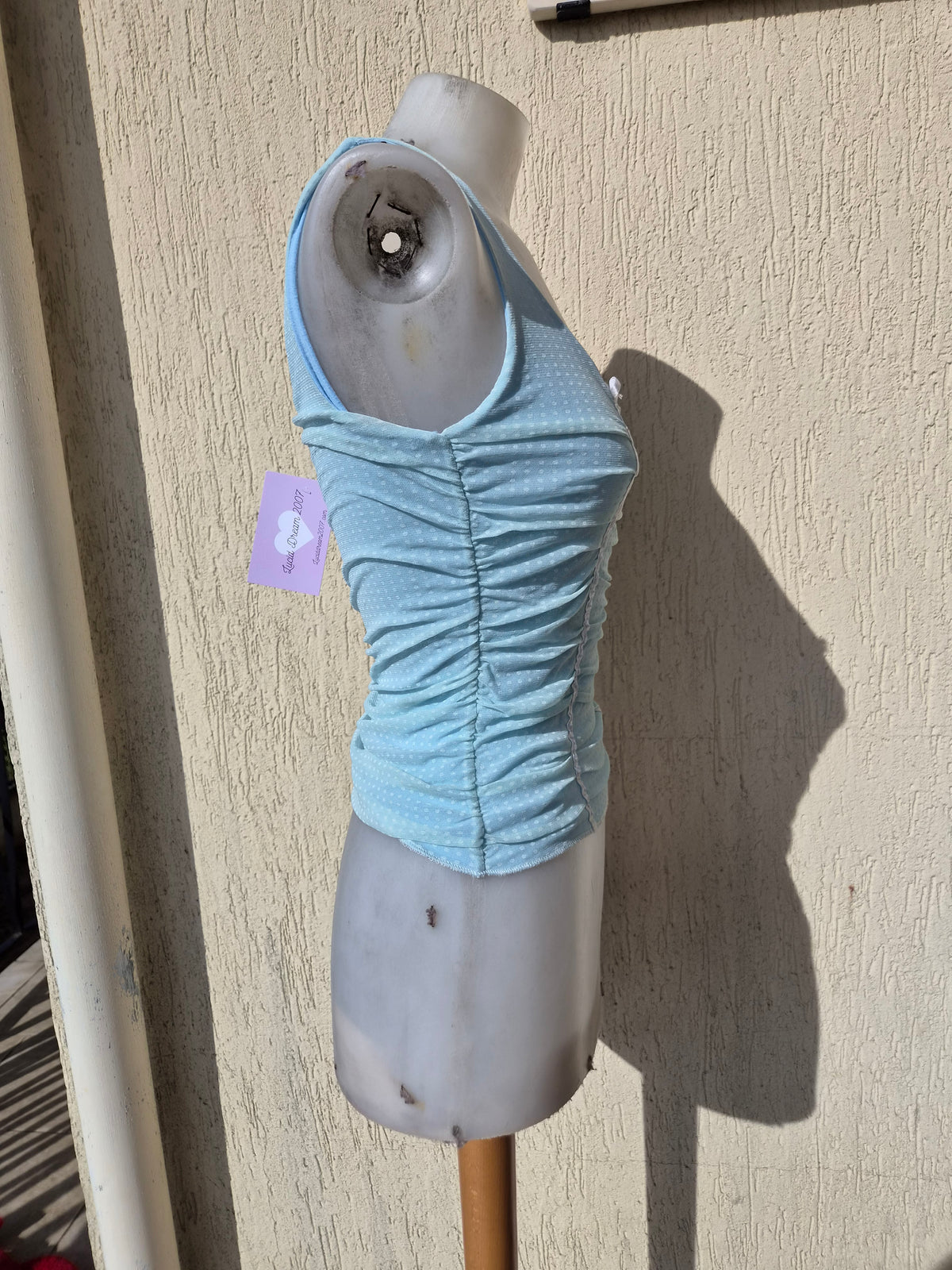 Blue pleated voile top with polka dots