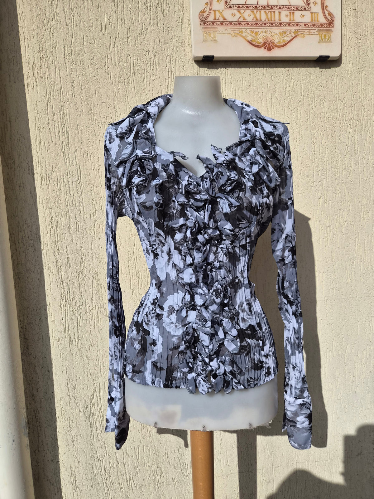 Grey-toned ruffled blouse