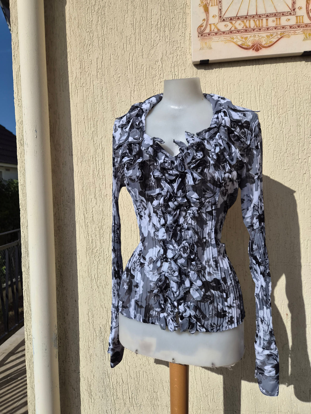 Grey-toned ruffled blouse